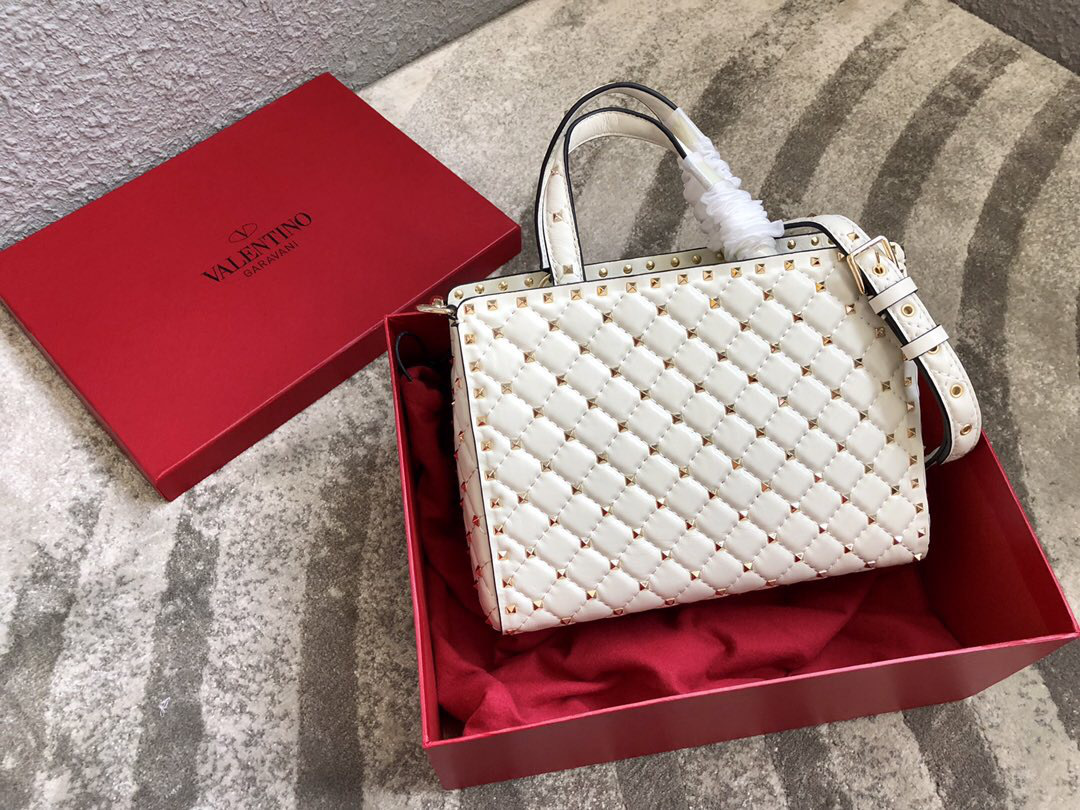 Va1e*ntin0 Garavani Rockstud Spike Lambskin Handbag in white