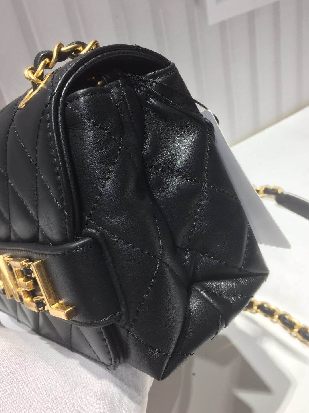 Ch**el small flap bag calfskin goldtone metal black