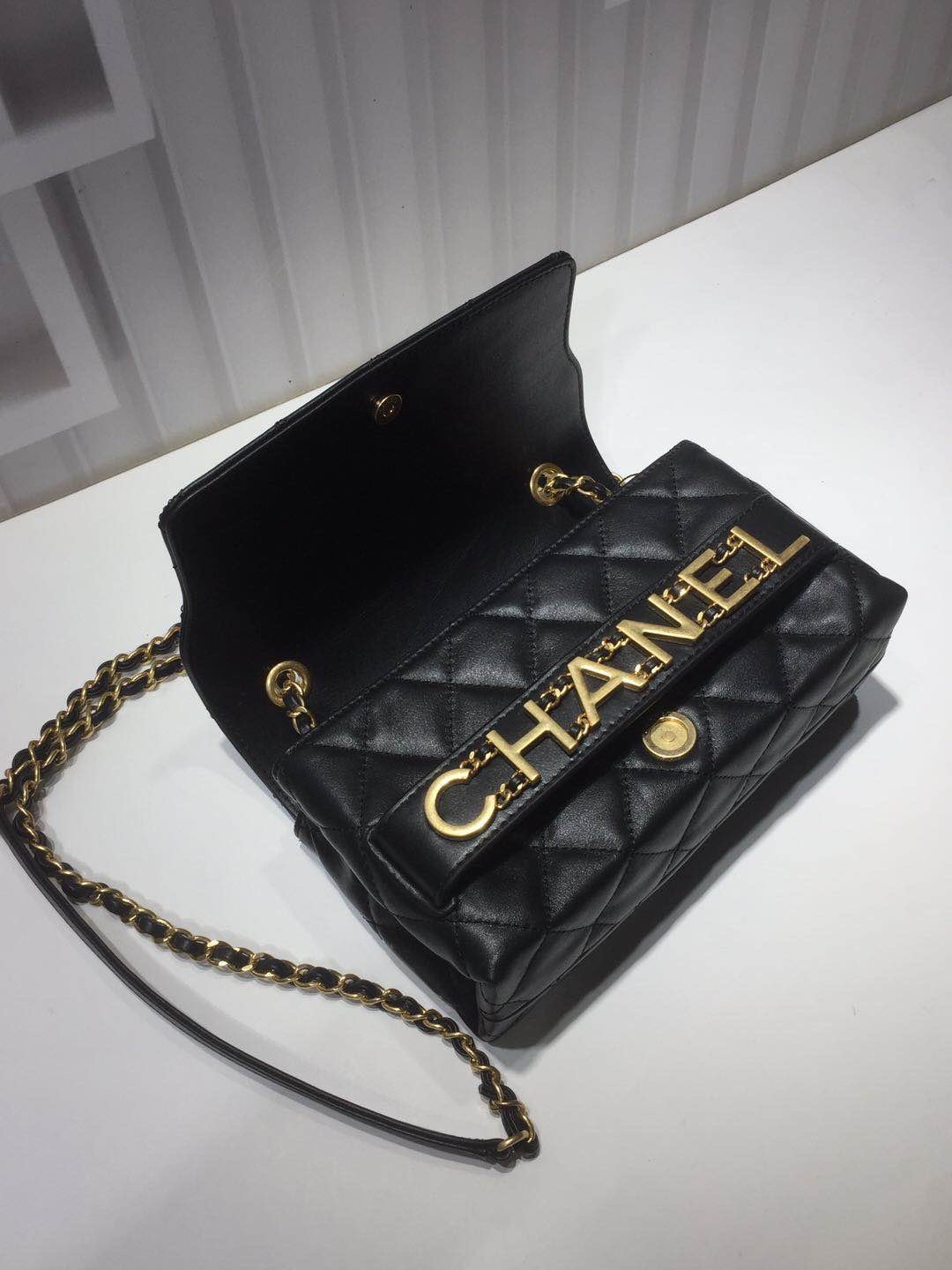Ch**el small flap bag calfskin goldtone metal black