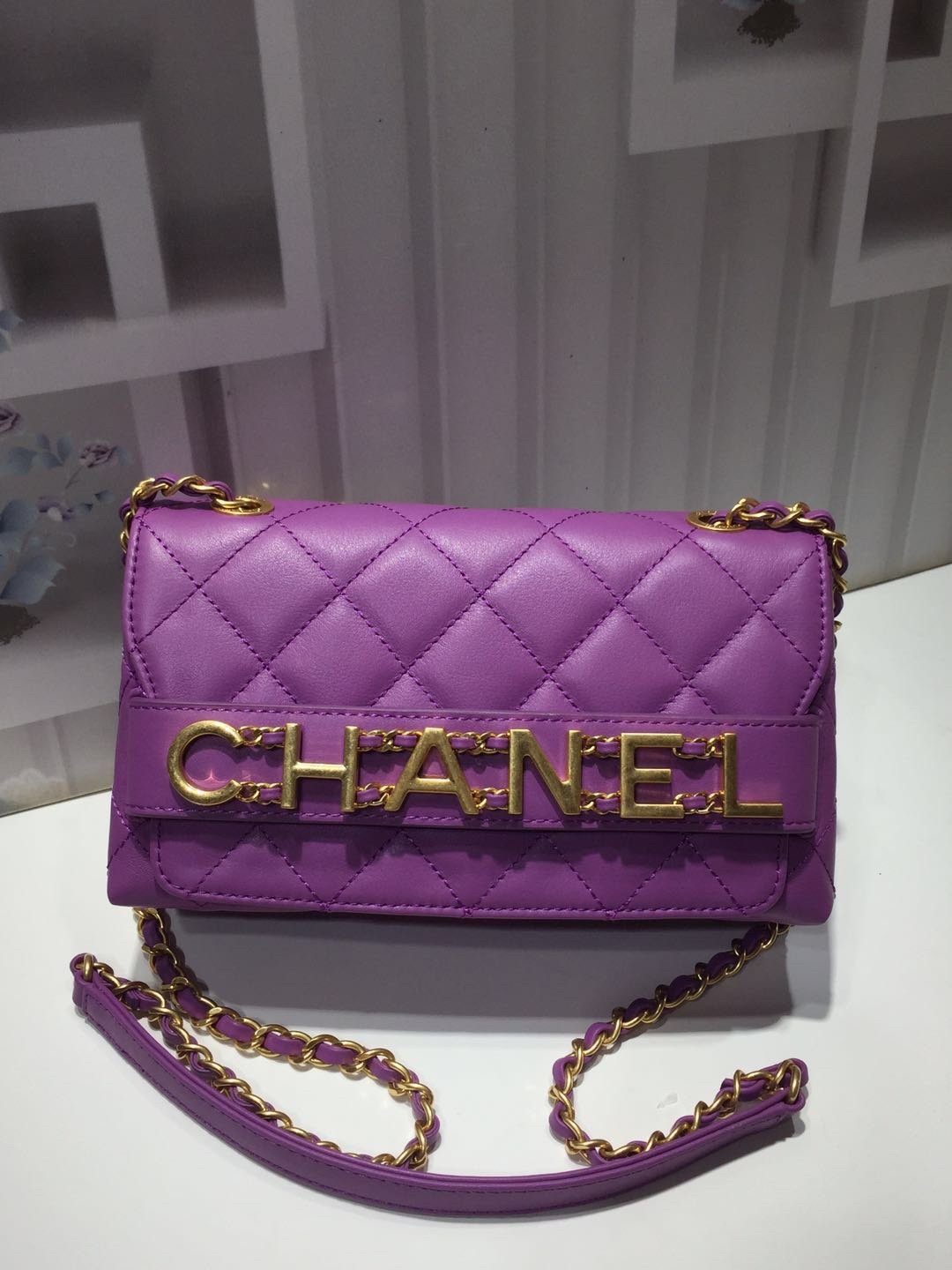 Ch**el small flap bag calfskin goldtone metal purple