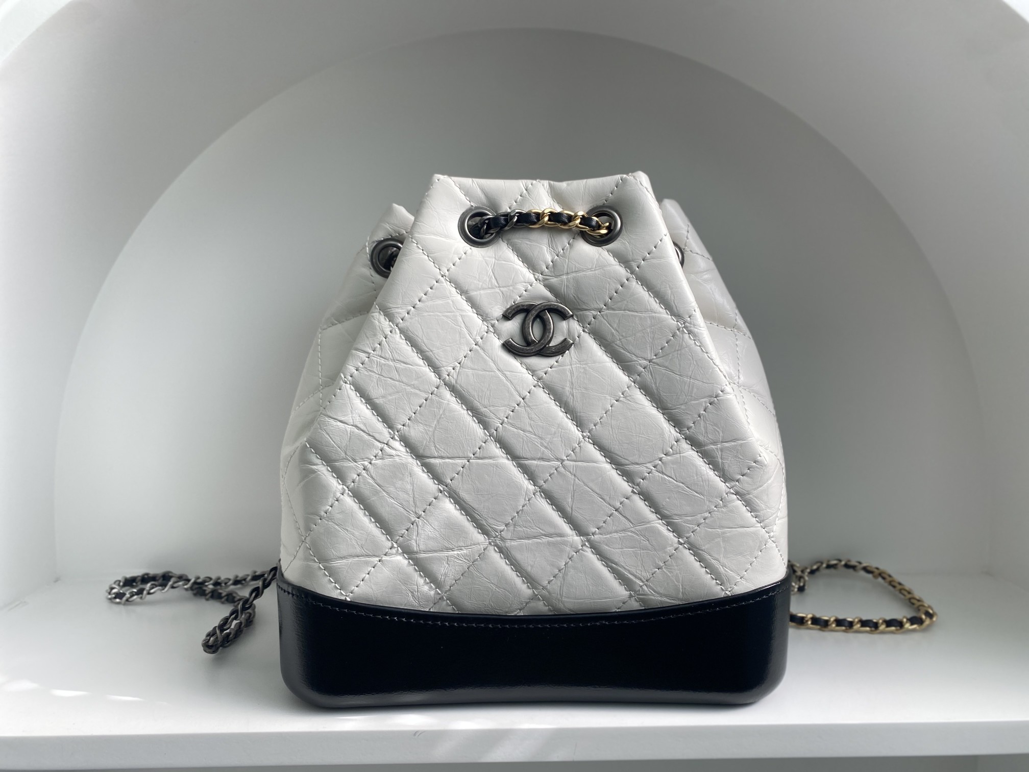 Bagsaaa Ch**el WHITE QUILTED AGED CALFSKIN SMALL GABRIELLE BACKPACK - 26x25x11cm