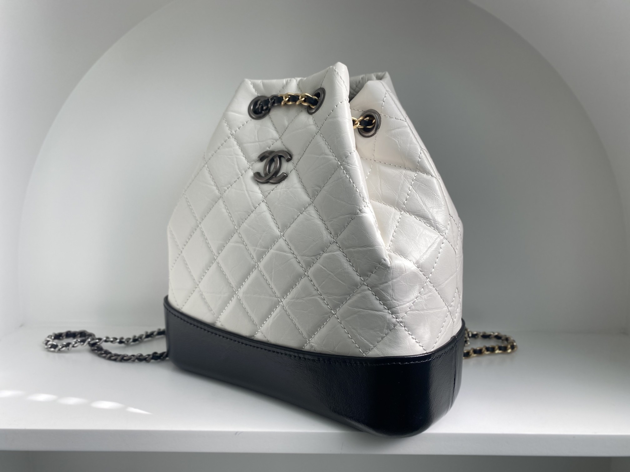 Bagsaaa Ch**el WHITE QUILTED AGED CALFSKIN SMALL GABRIELLE BACKPACK - 26x25x11cm