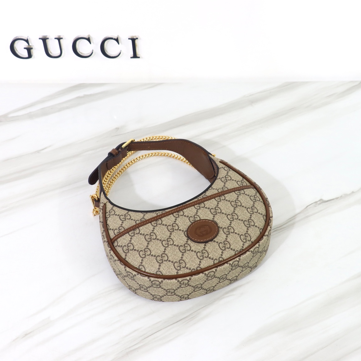 Bagsaaa Gvc*1 GG Half Moon Shaped Mini Bag in Beige and ebony GG Svp*me canvas - 22 x 12.5 x 5cm