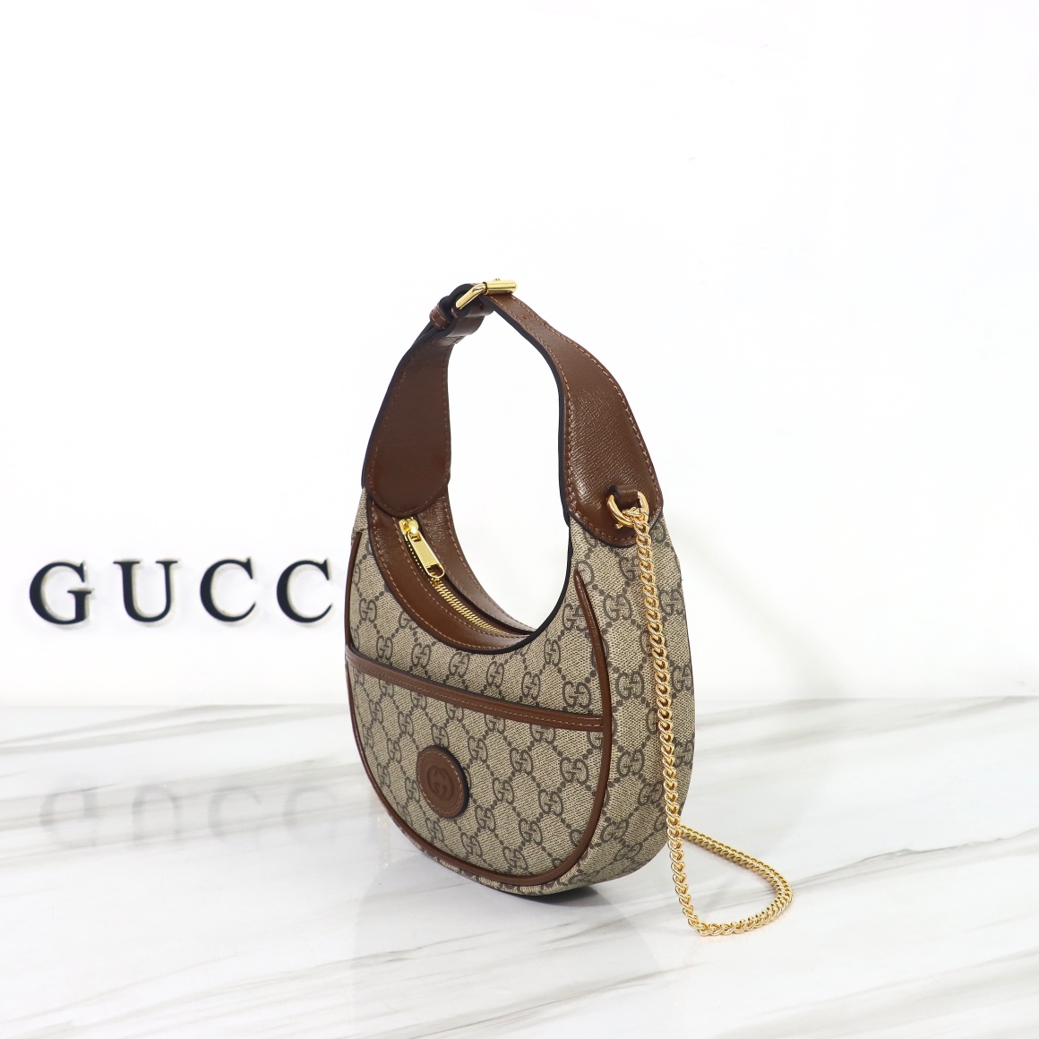 Bagsaaa Gvc*1 GG Half Moon Shaped Mini Bag in Beige and ebony GG Svp*me canvas - 22 x 12.5 x 5cm