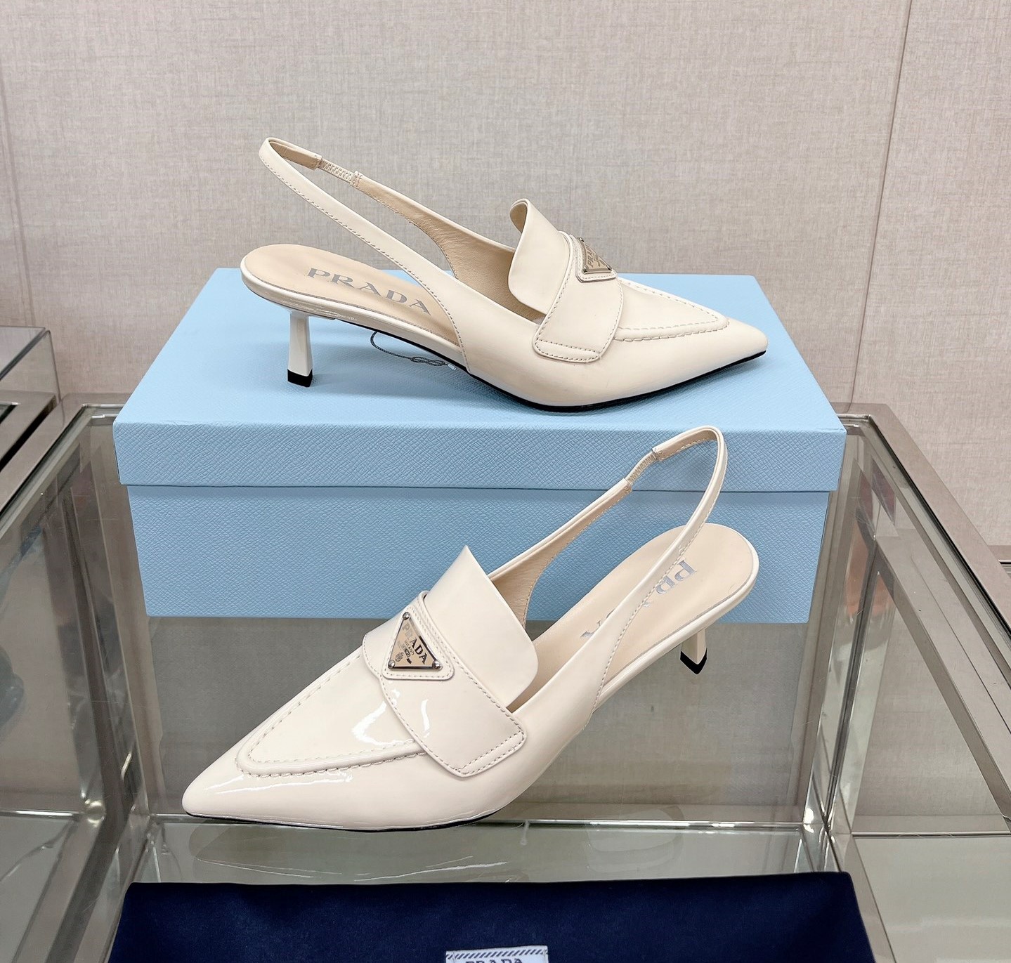 Bagsaaa Pra*a Patent white leather slingbacks (45 mm)