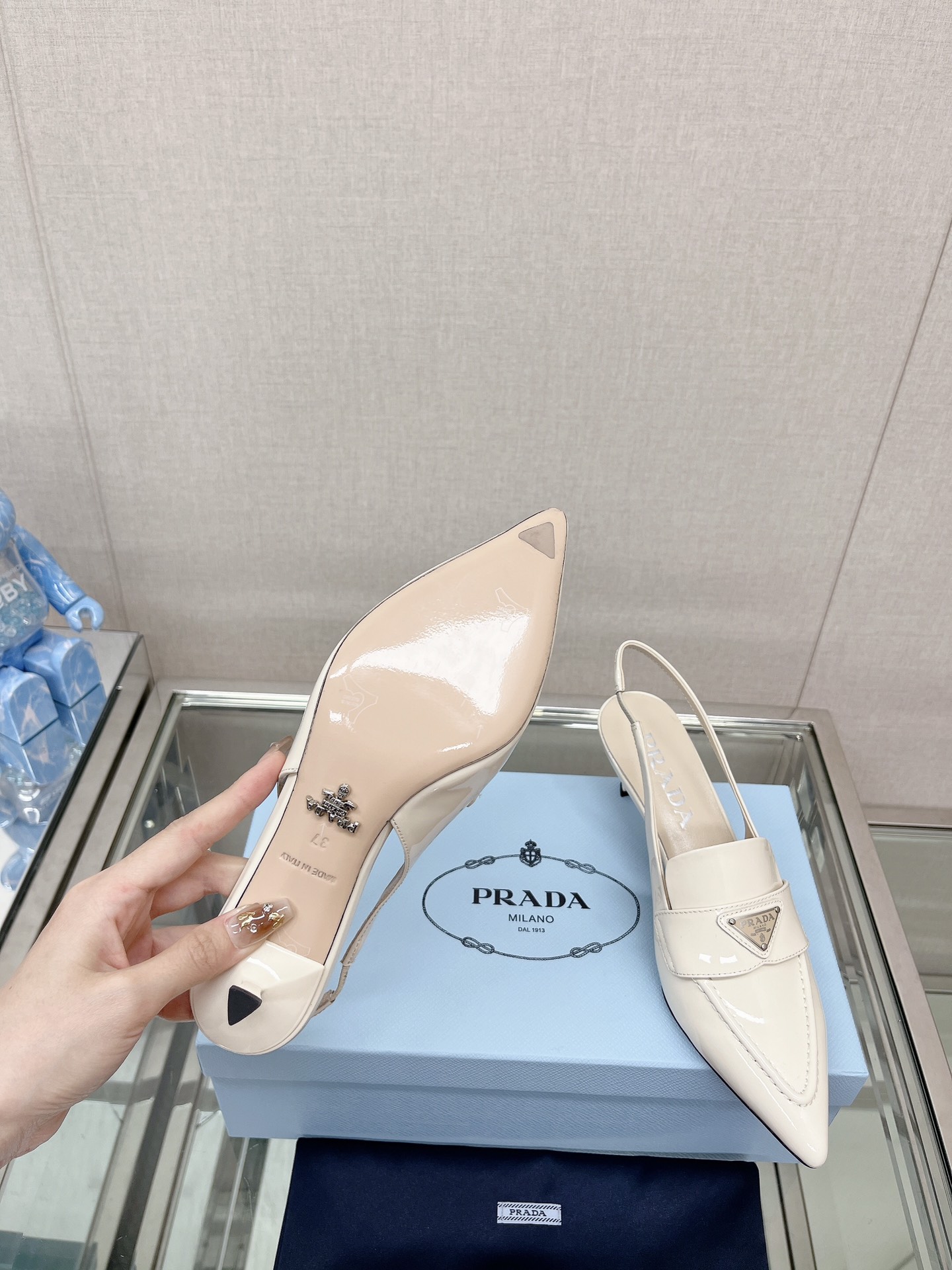 Bagsaaa Pra*a Patent white leather slingbacks (45 mm)