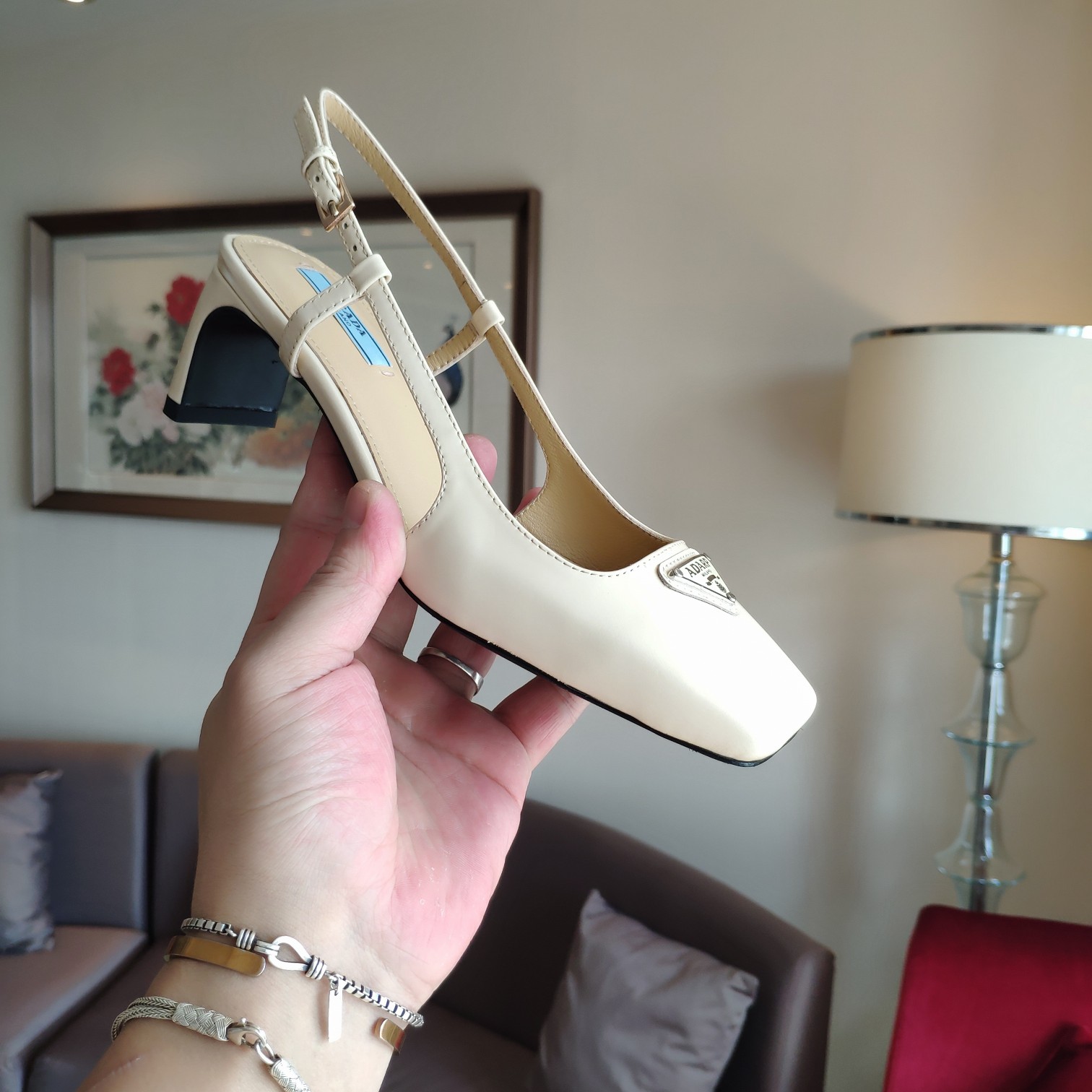 Bagsaaa Pra*a 55 Logo-embellished Leather Slingback Pumps In Beige