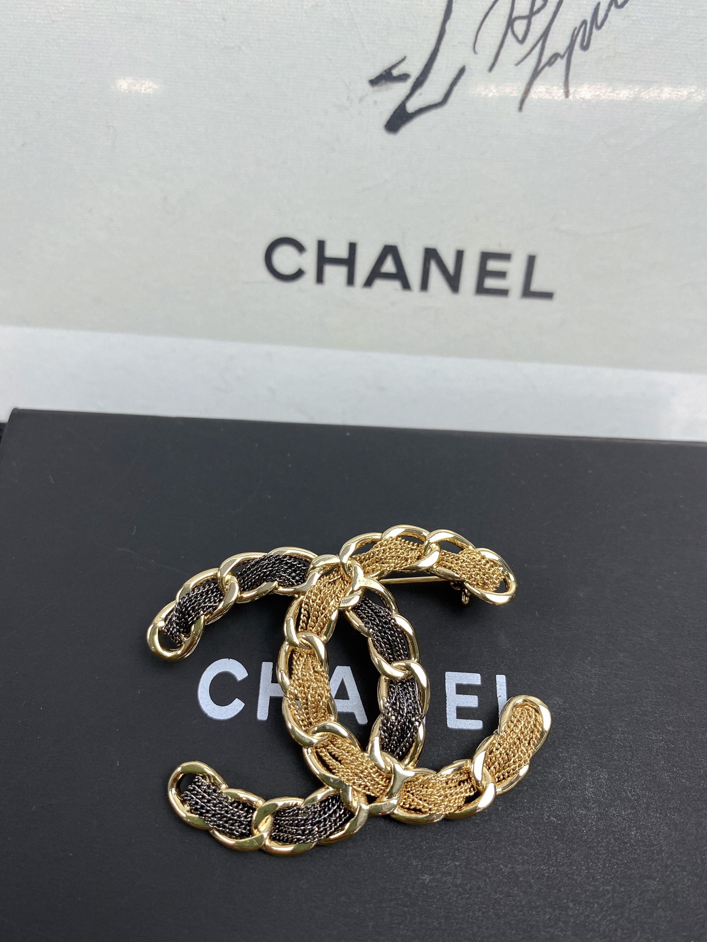 Bagsaaa Ch**el Black and Gold Brooch