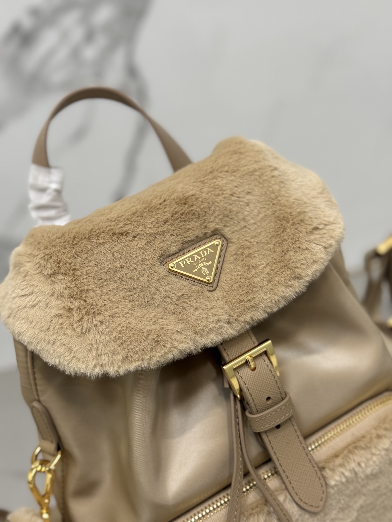 Bagsaaa Pra*a Re-Nylon and shearling backpack in beige - 25x20.5x11.5cm