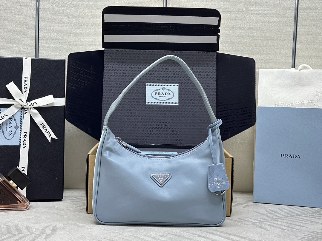 Bagsaaa Re-Nylon Pra*a Re-Edition 2000 mini-bag light blue - 22x6x17 cm