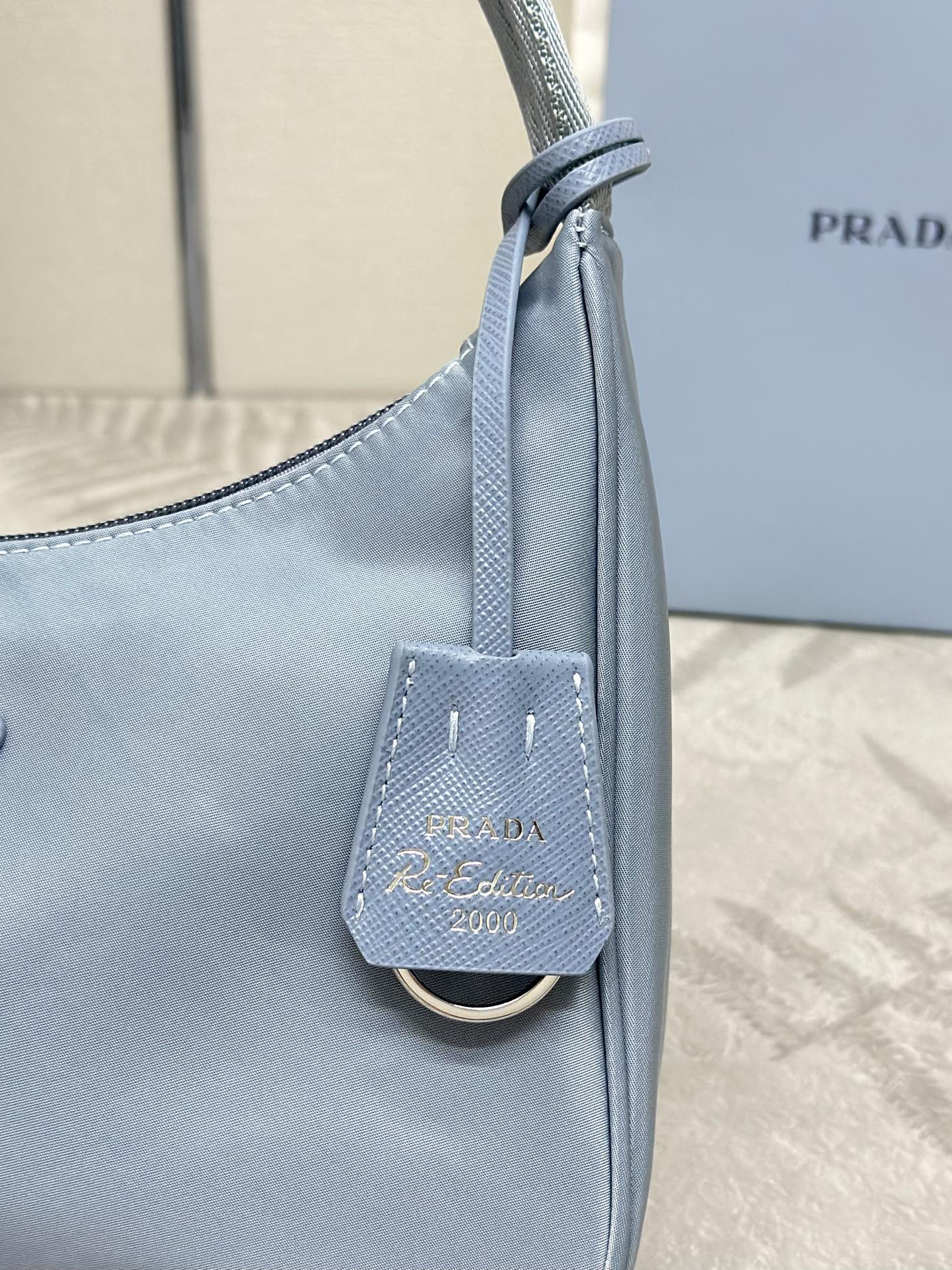 Bagsaaa Re-Nylon Pra*a Re-Edition 2000 mini-bag light blue - 22x6x17 cm