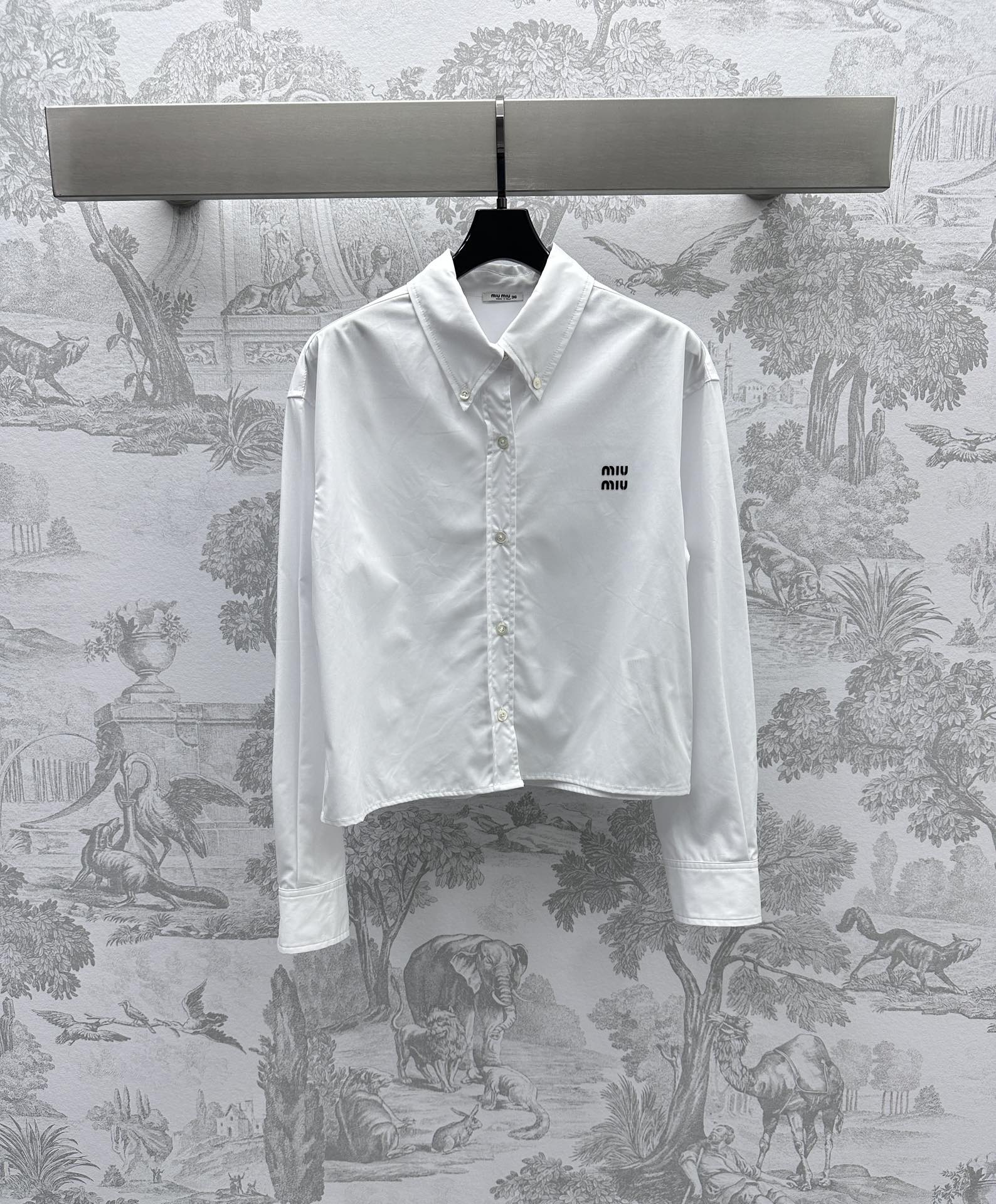 Bagsaaa M1um1u logo-embroidered cotton shirt white