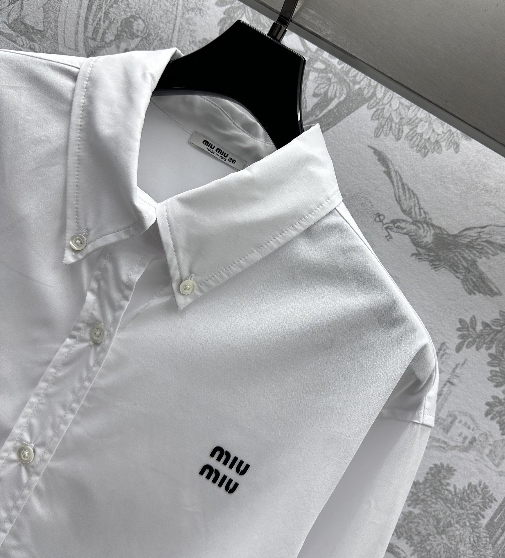 Bagsaaa M1um1u logo-embroidered cotton shirt white