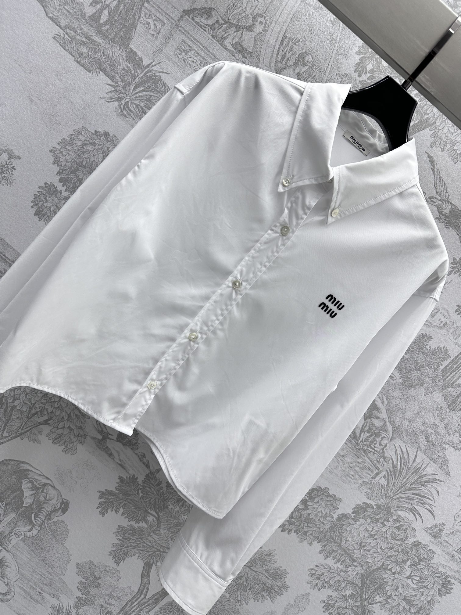 Bagsaaa M1um1u logo-embroidered cotton shirt white