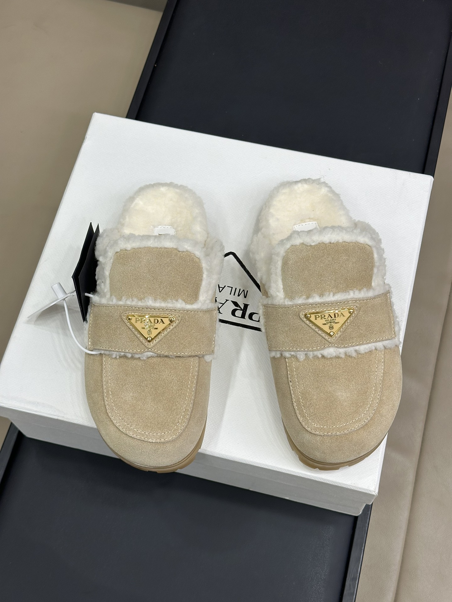 Bagsaaa Pra*a Suede and shearling slippers beige