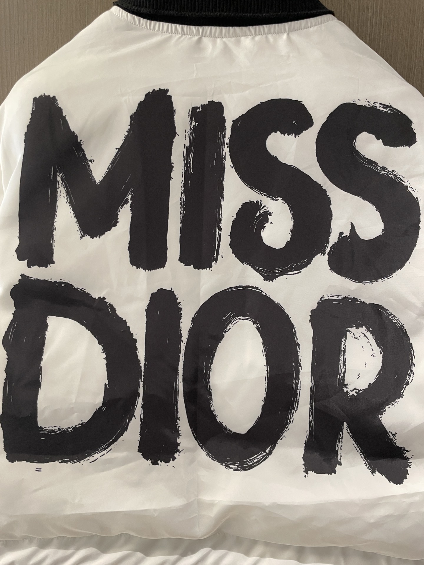 Bagsaaa D10rAlps Cropped Bomber Jacket White Padded Technical Taffeta with Black Miss D10r Graffiti Motif