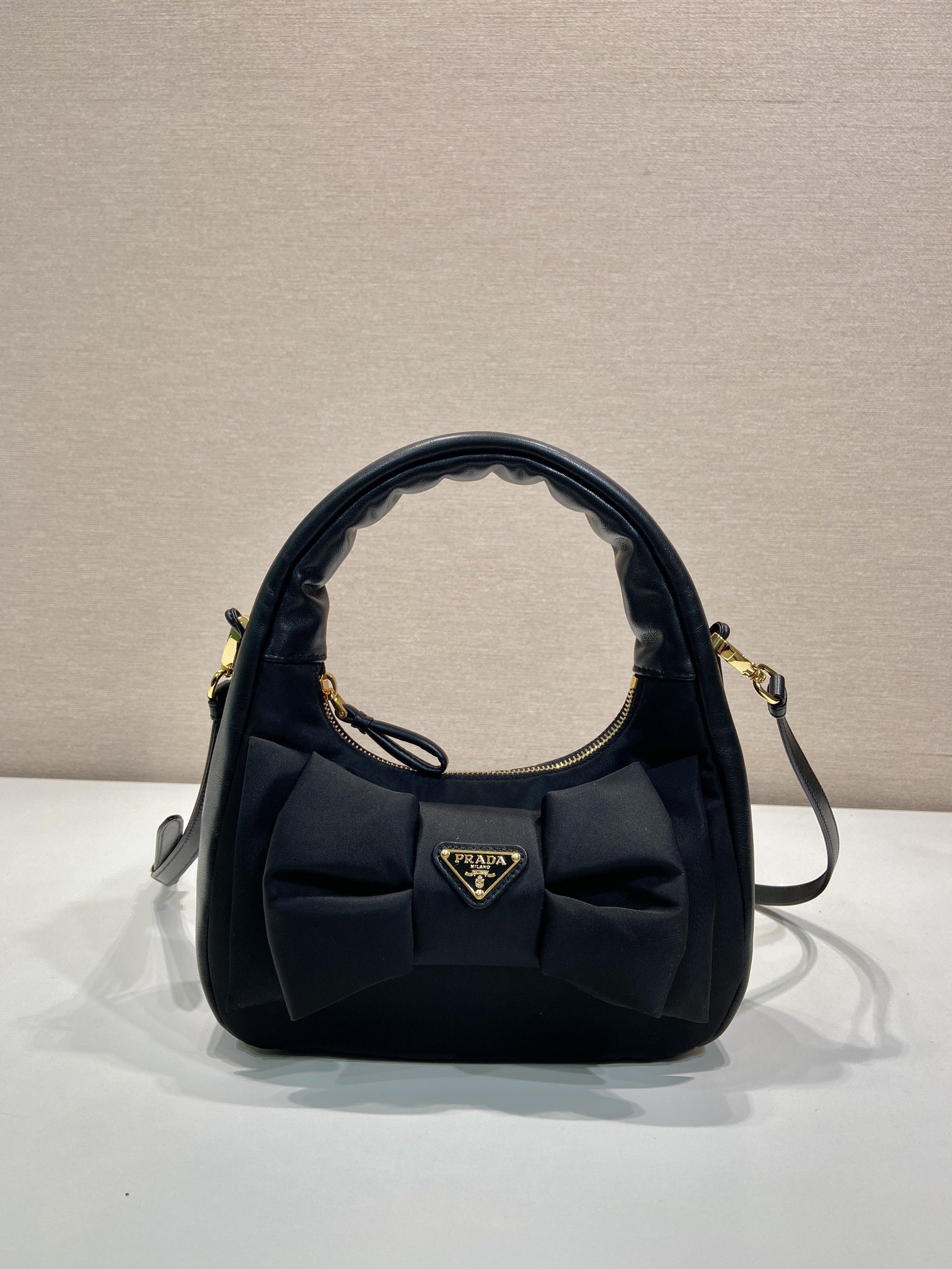 Bagsaaa Pra*a Re-Nylon and nappa leather mini-bag with bow 1BC241 black - 22cm