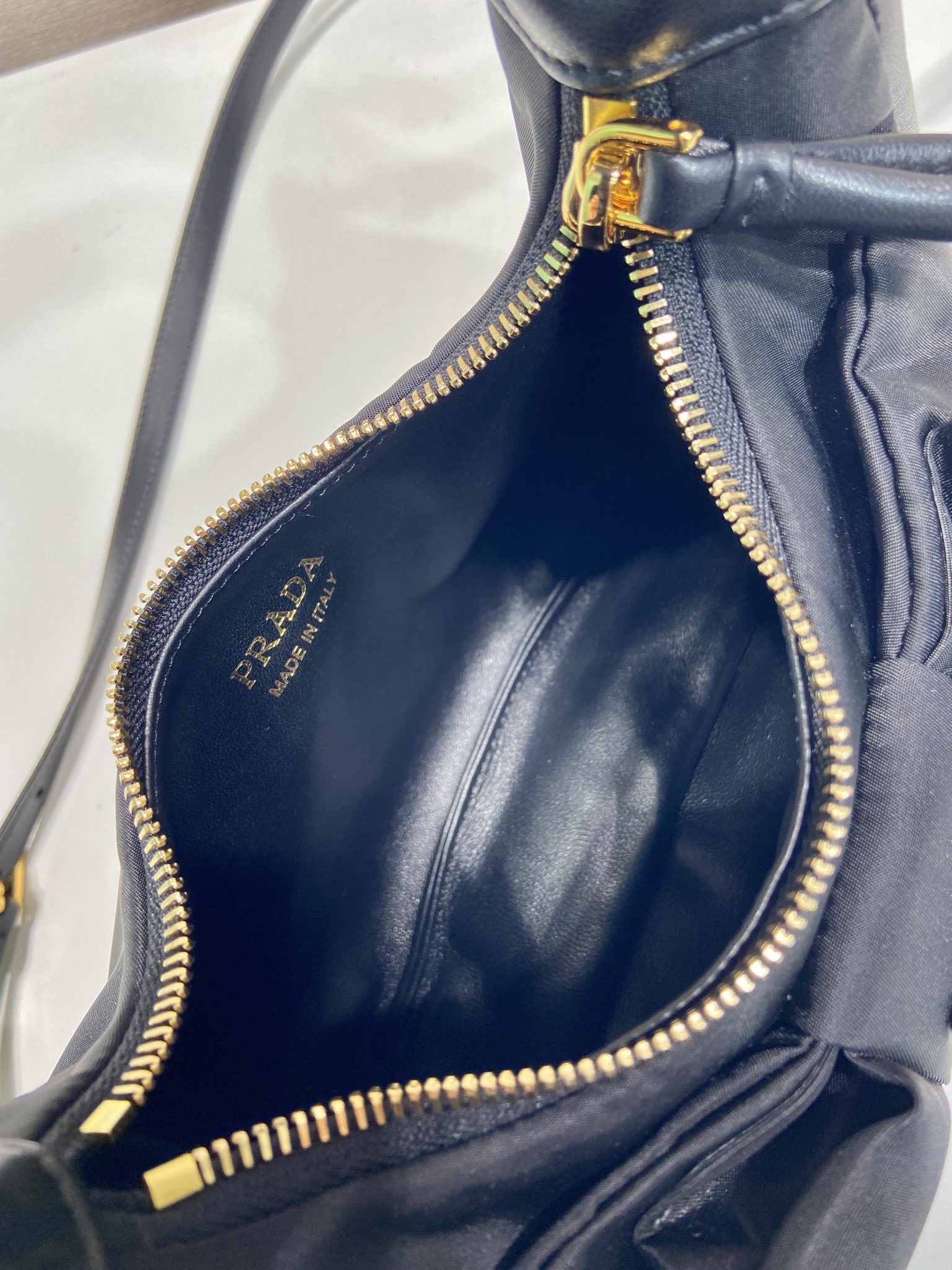 Bagsaaa Pra*a Re-Nylon and nappa leather mini-bag with bow 1BC241 black - 22cm