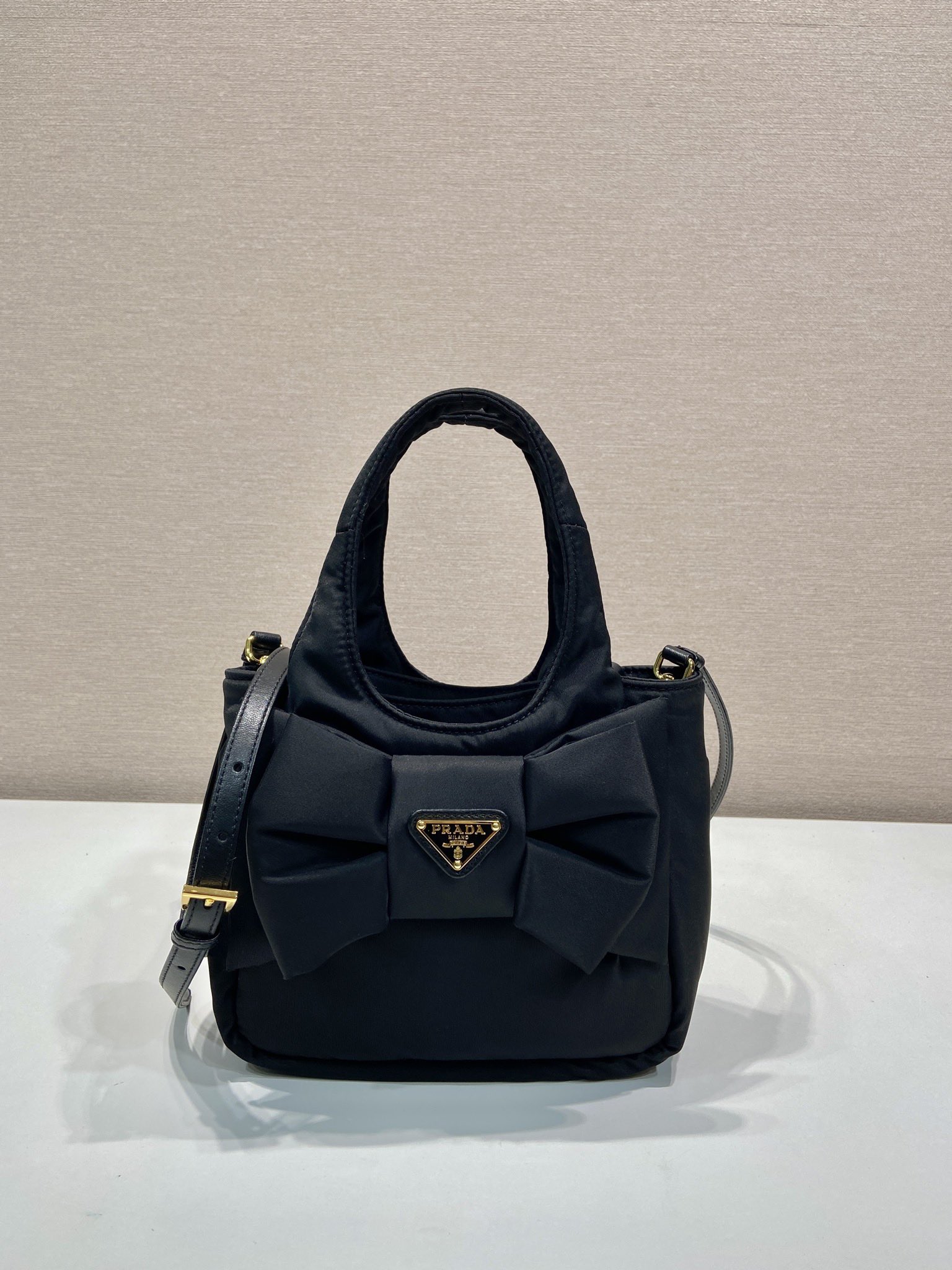 Bagsaaa Pra*a Padded Re-Nylon mini-bag with bow 1BA359 black - 18cm