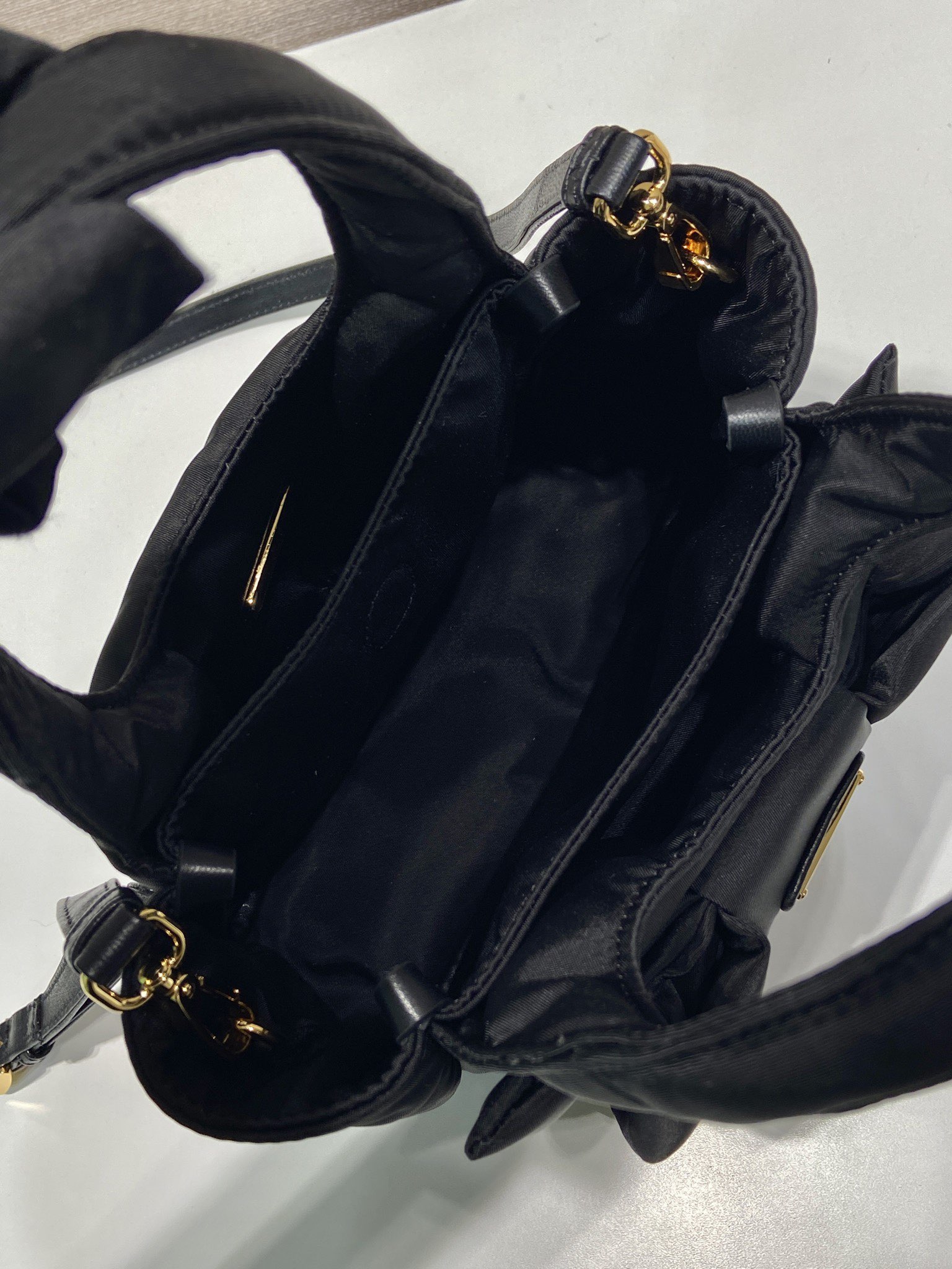 Bagsaaa Pra*a Padded Re-Nylon mini-bag with bow 1BA359 black - 18cm