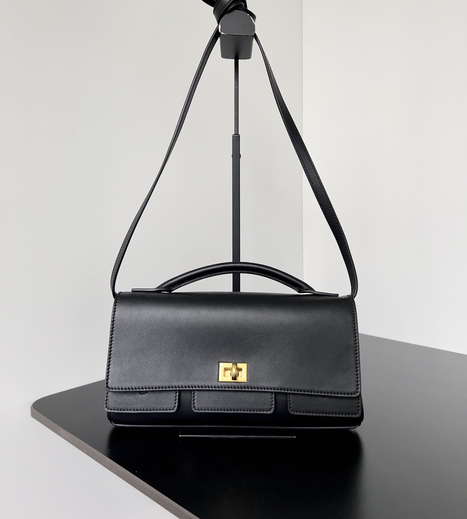 Bagsaaa Ba1en*iaga Bel Air Small Clutch On Strap in black & gold - 27cm