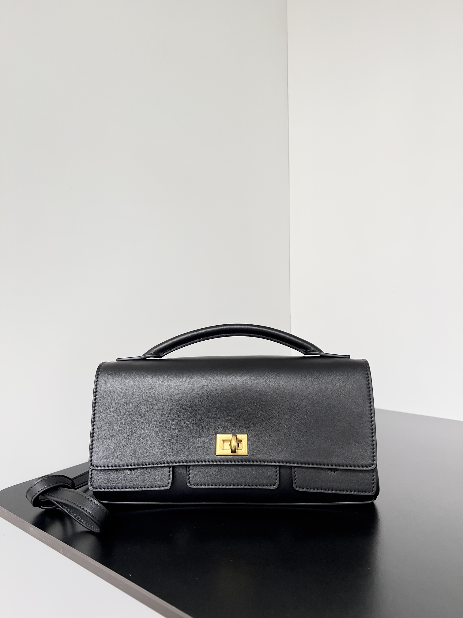 Bagsaaa Ba1en*iaga Bel Air Small Clutch On Strap in black & gold - 27cm