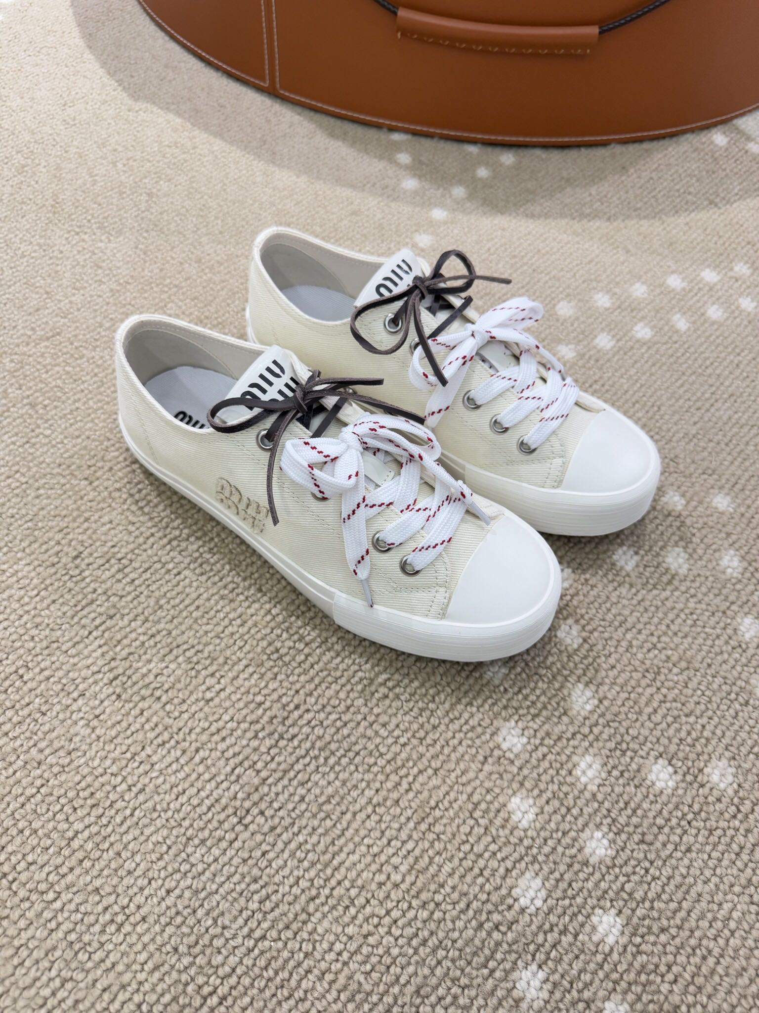 Bagsaaa Miu Miu Washed denim sneakers ivory
