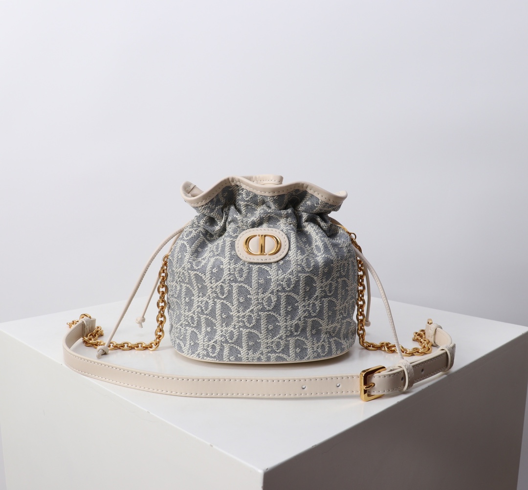 Bagsaaa D10r 30 Montaigne Mini Bucket Bag with Drawstring Blue D10r Oblique Chambray with Raffia Effect - 18.5cm