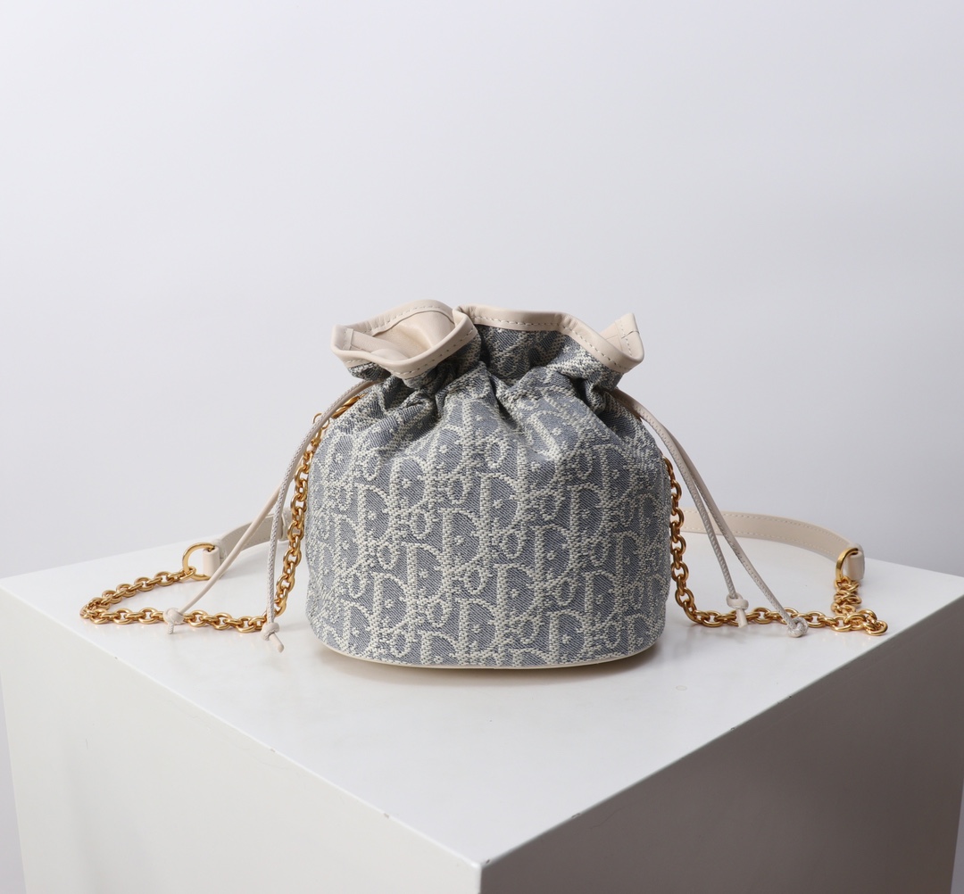 Bagsaaa D10r 30 Montaigne Mini Bucket Bag with Drawstring Blue D10r Oblique Chambray with Raffia Effect - 18.5cm