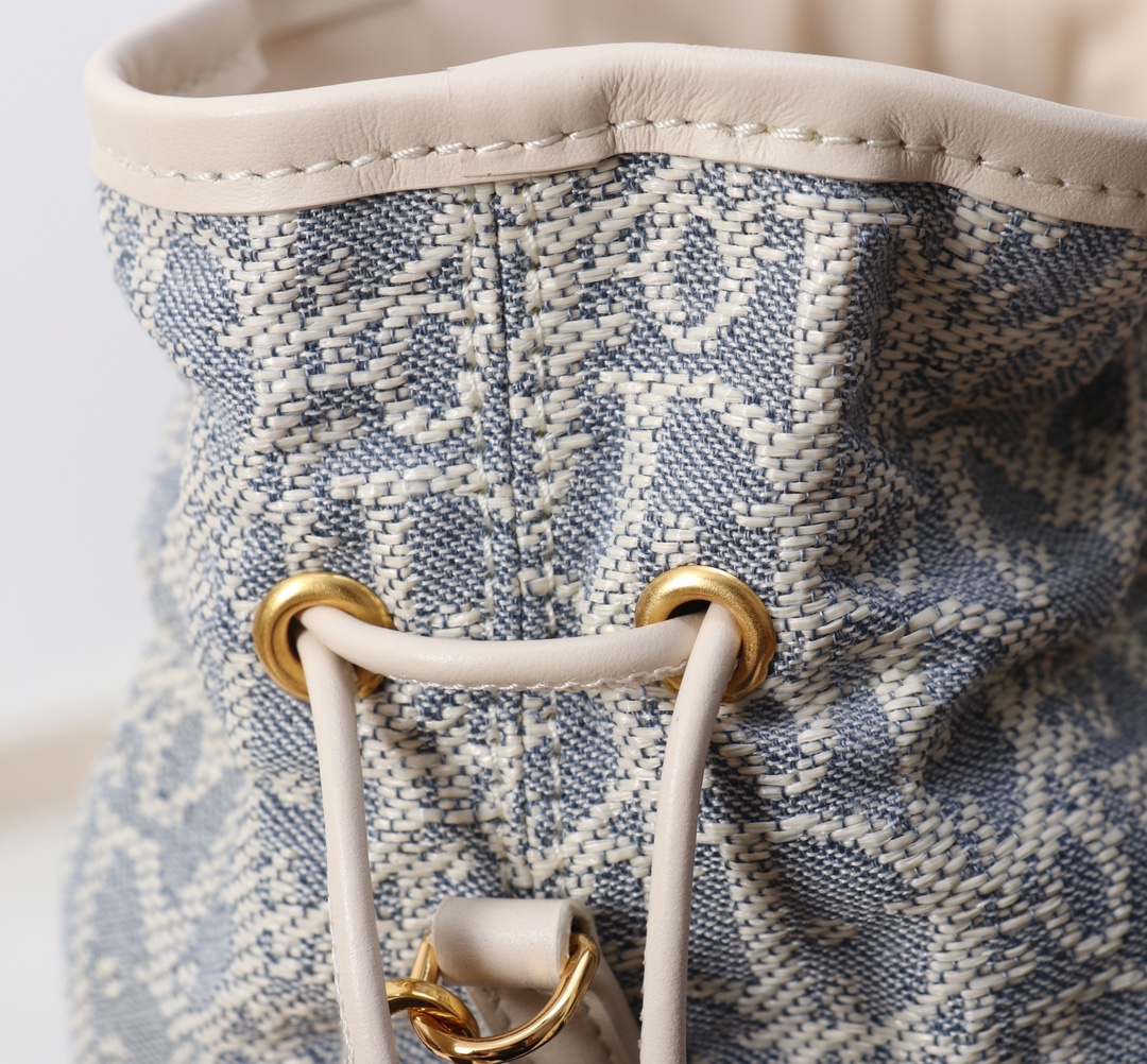 Bagsaaa D10r 30 Montaigne Mini Bucket Bag with Drawstring Blue D10r Oblique Chambray with Raffia Effect - 18.5cm