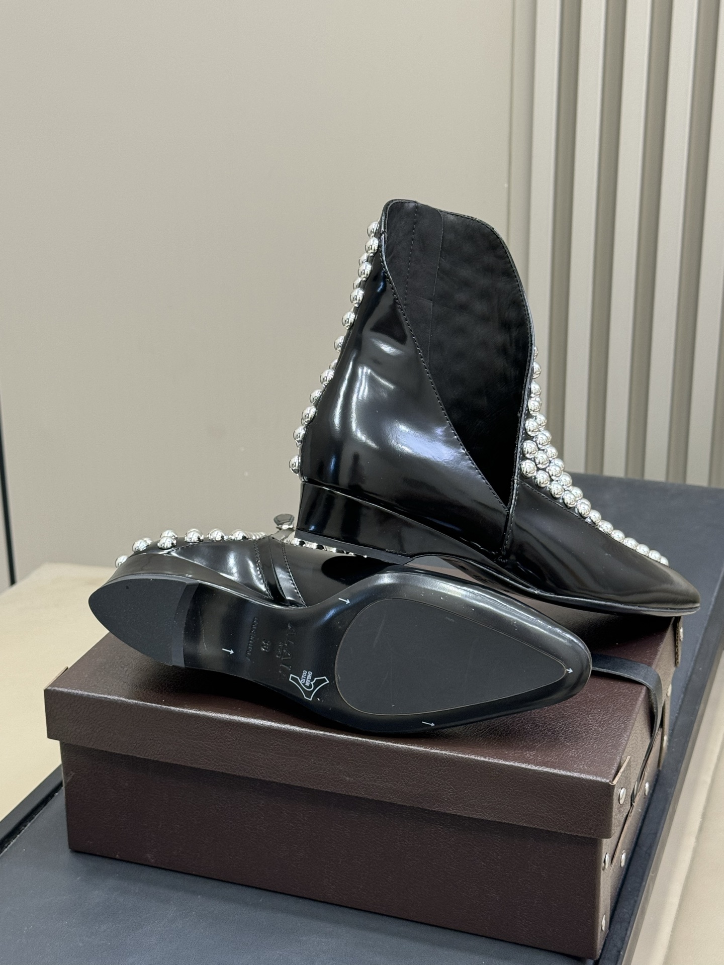 Bagsaaa Alaia Asymetric Ankle Boots In Glossy Calfskin With Studs
