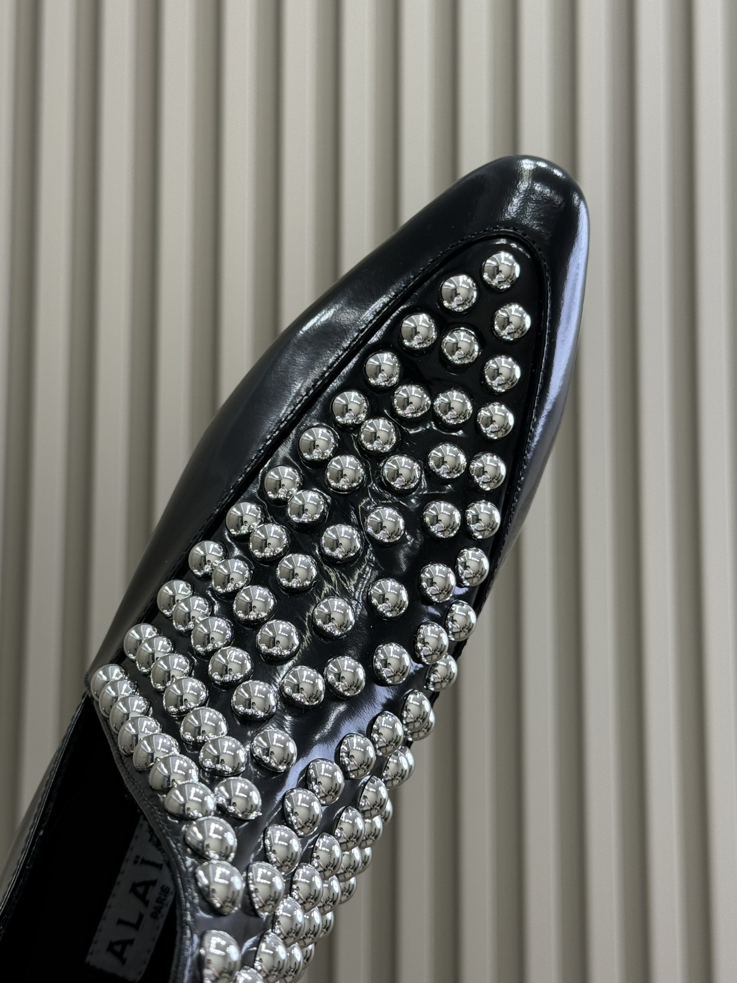 Bagsaaa Alaia Asymetric Ankle Boots In Glossy Calfskin With Studs
