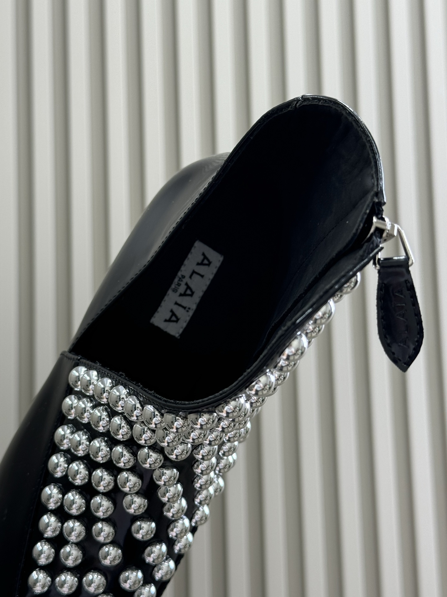 Bagsaaa Alaia Asymetric Ankle Boots In Glossy Calfskin With Studs