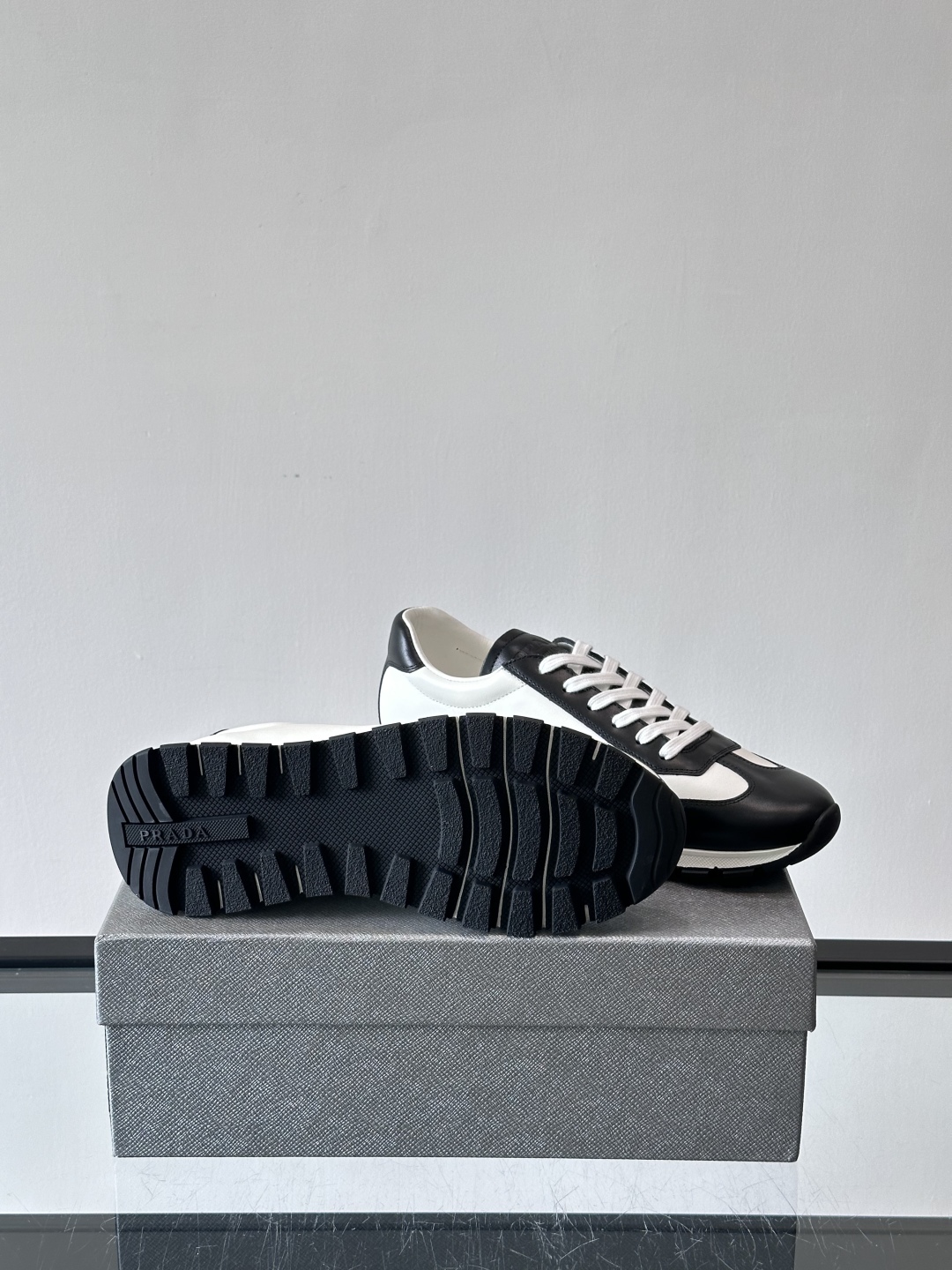 Bagsaaa Pra*a Downtown low-top sneakers in white and black