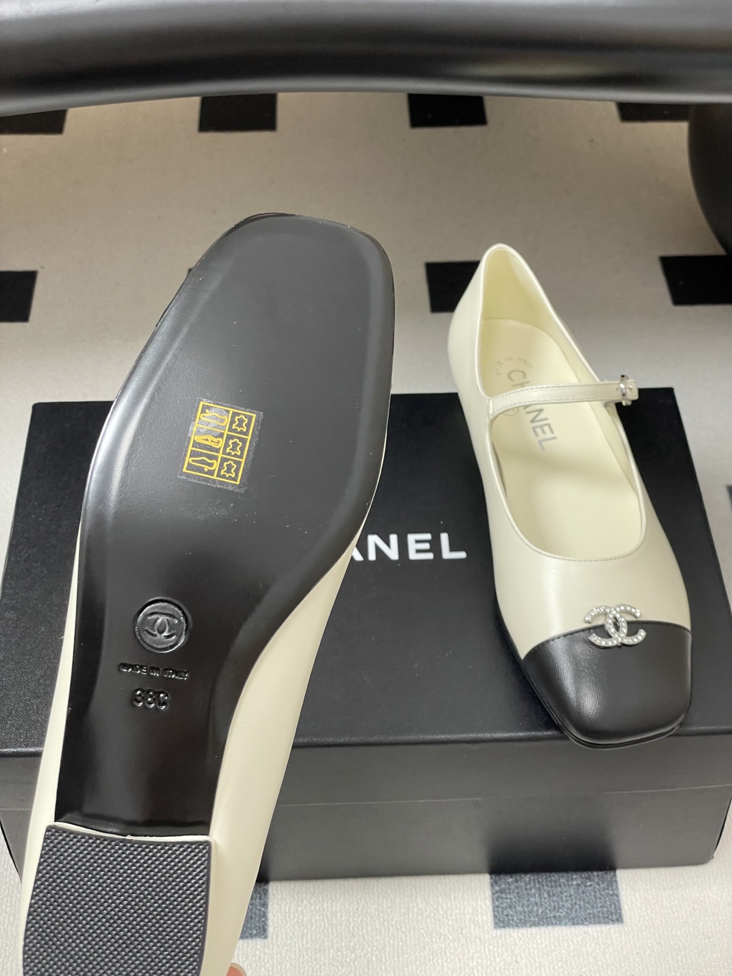 Bagsaaa Ch**el black & white Mary Jane flats with crystal-embellished CC