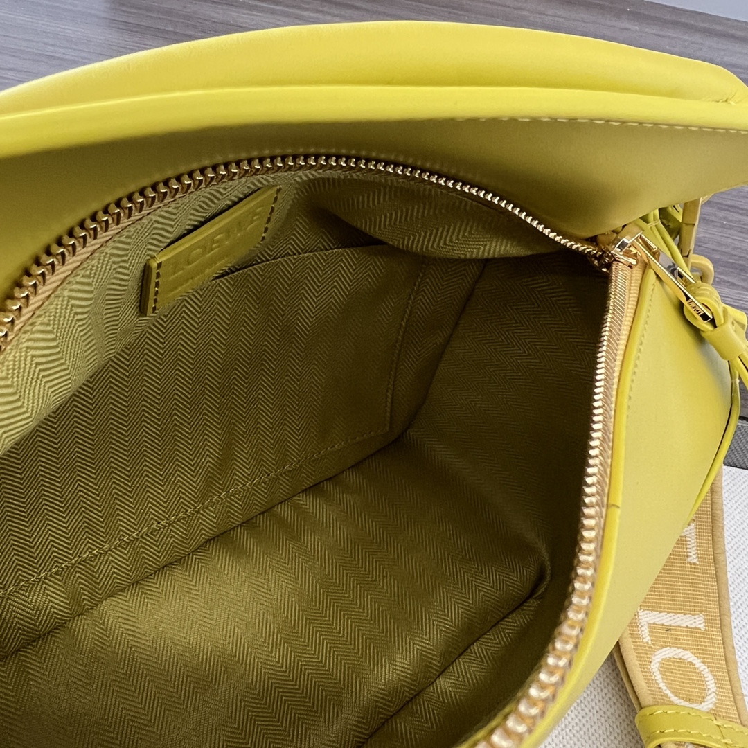 Bagsaaa L0ew* Puzzle bag in lime yellow with a wide logo-print strap - 24cm