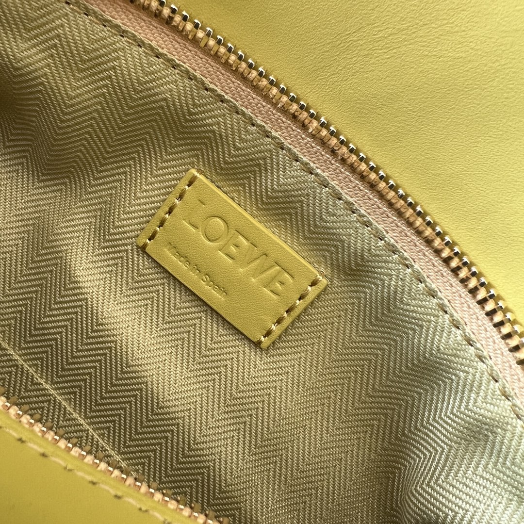 Bagsaaa L0ew* Puzzle bag in lime yellow with a wide logo-print strap - 24cm