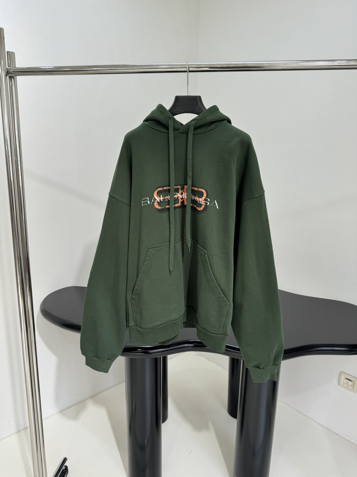 Bagsaaa Ba1en*iaga green hoodie with a shaded logo effect