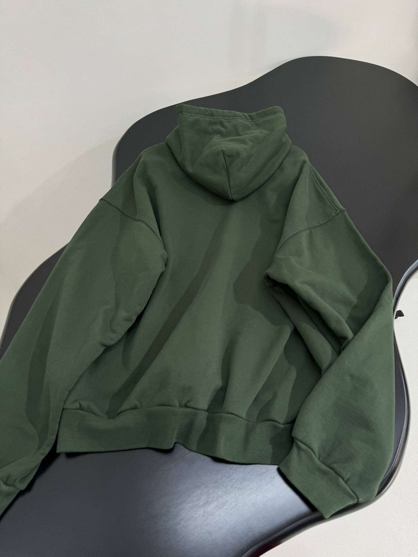 Bagsaaa Ba1en*iaga green hoodie with a shaded logo effect