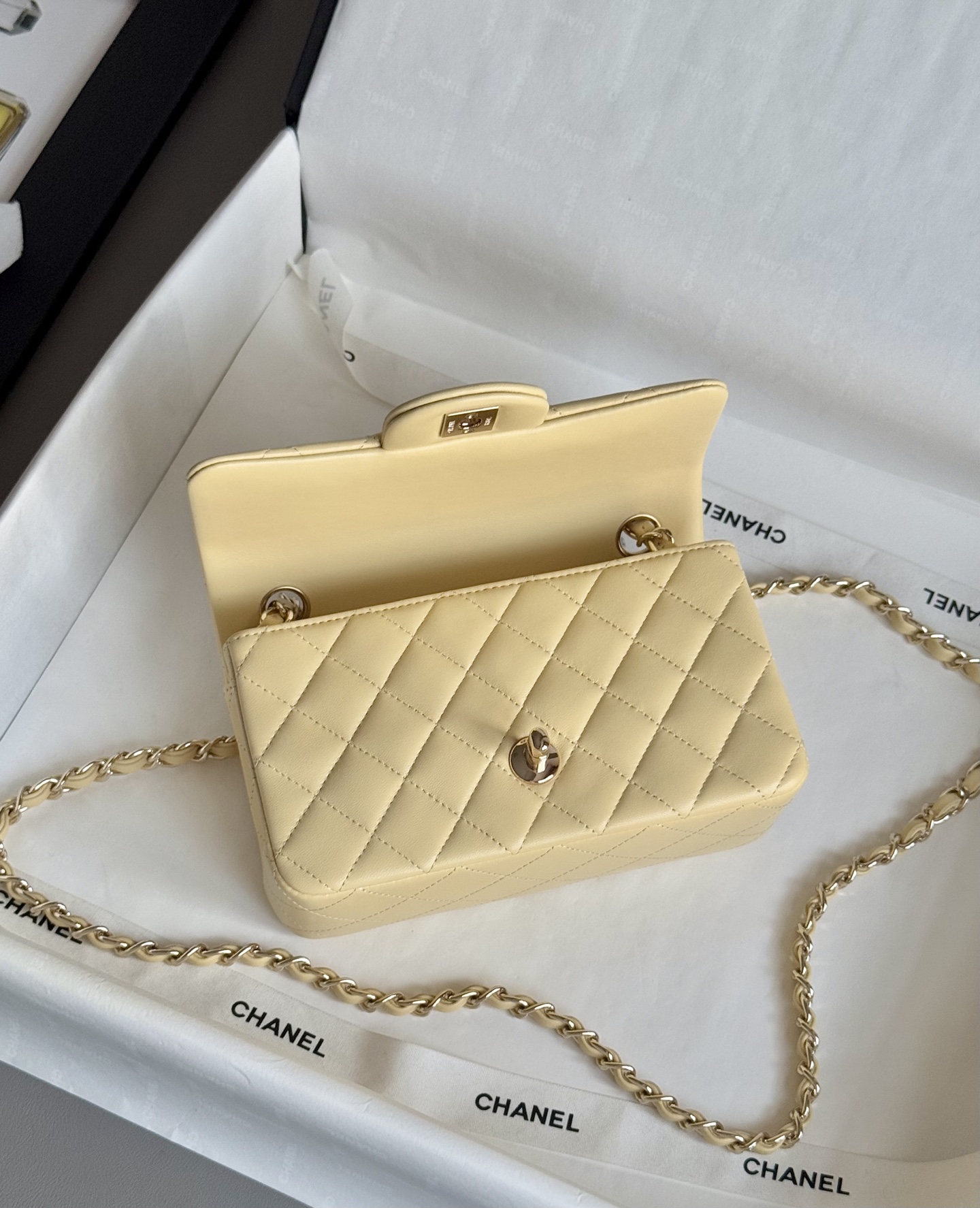 Ch**el Mini Classic Flap handbag in light yellow - 20cm