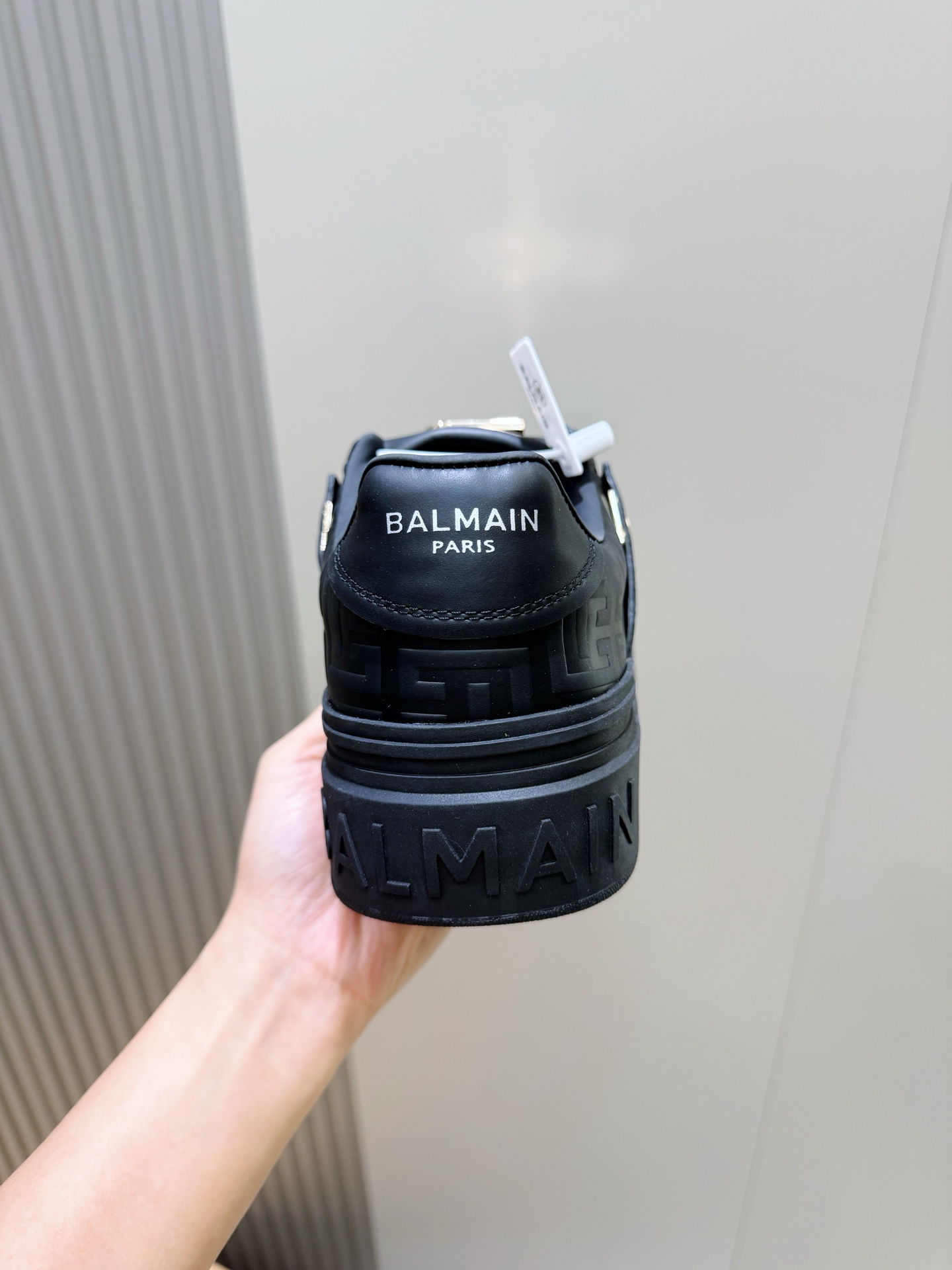 Bagsaaa Balmain black monogram-embossed leather sneakers