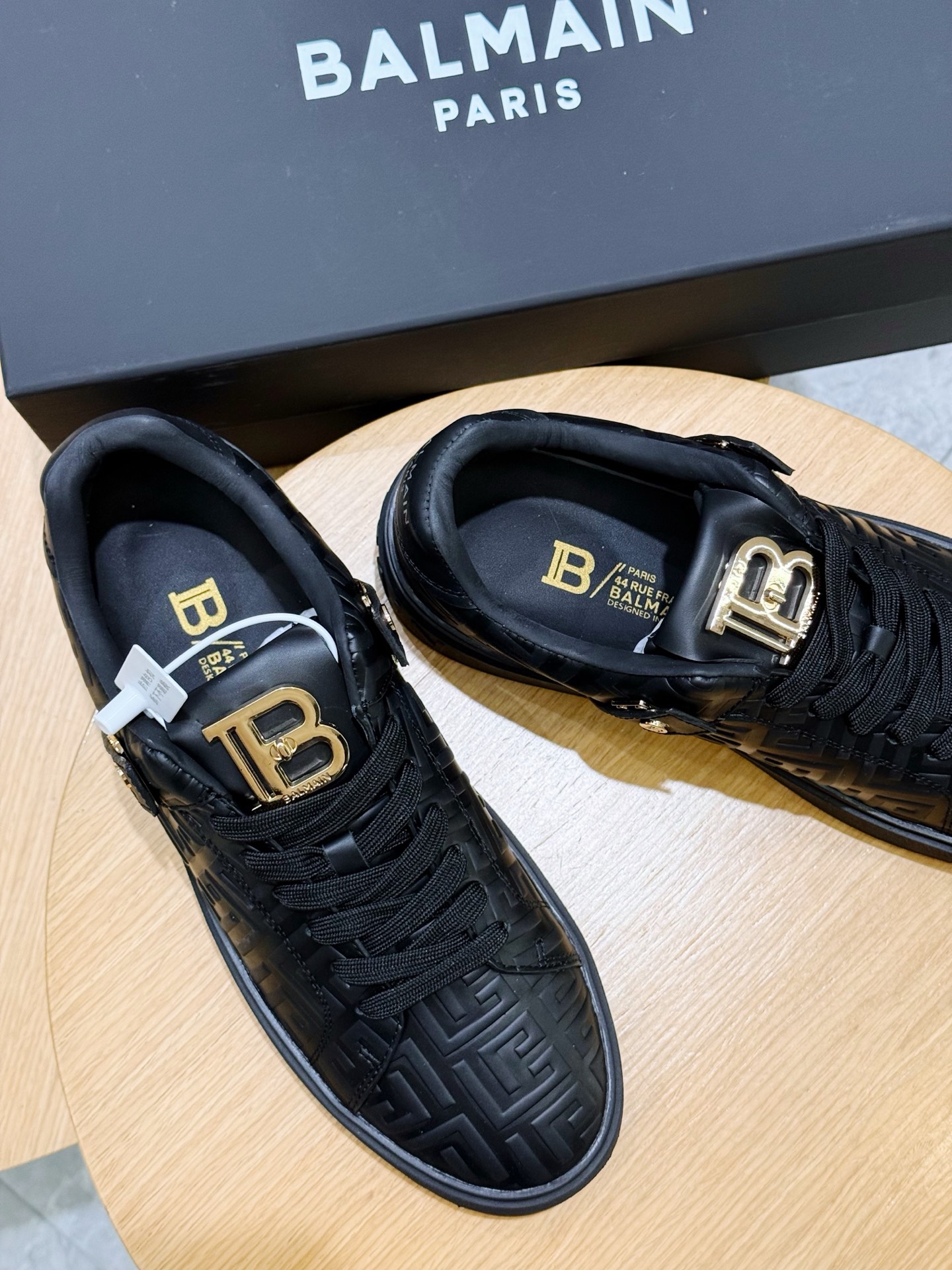 Bagsaaa Balmain black monogram-embossed leather sneakers