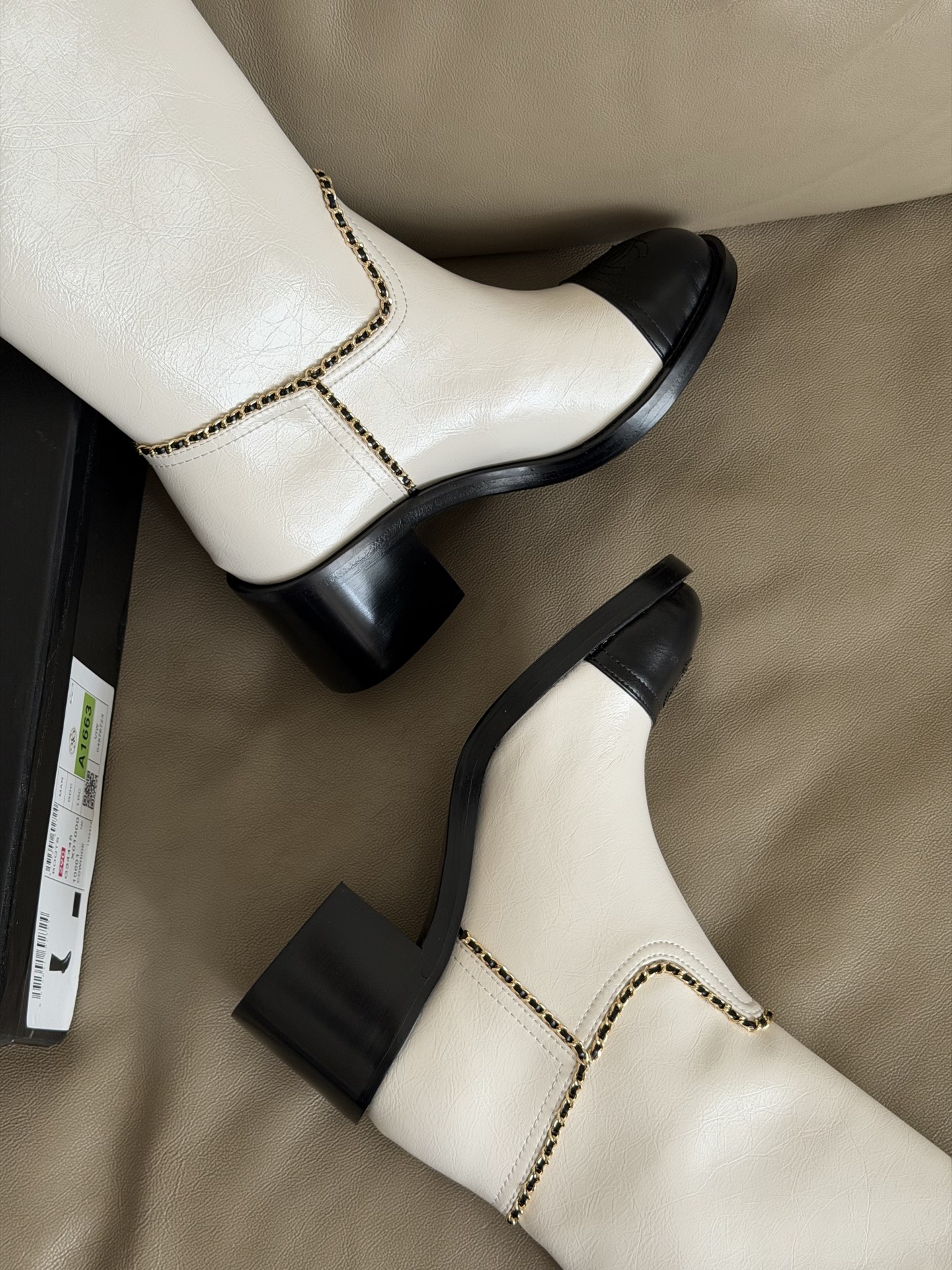 Bagsaaa Ch**el mid-calf boots in white patent leather with black cap toes