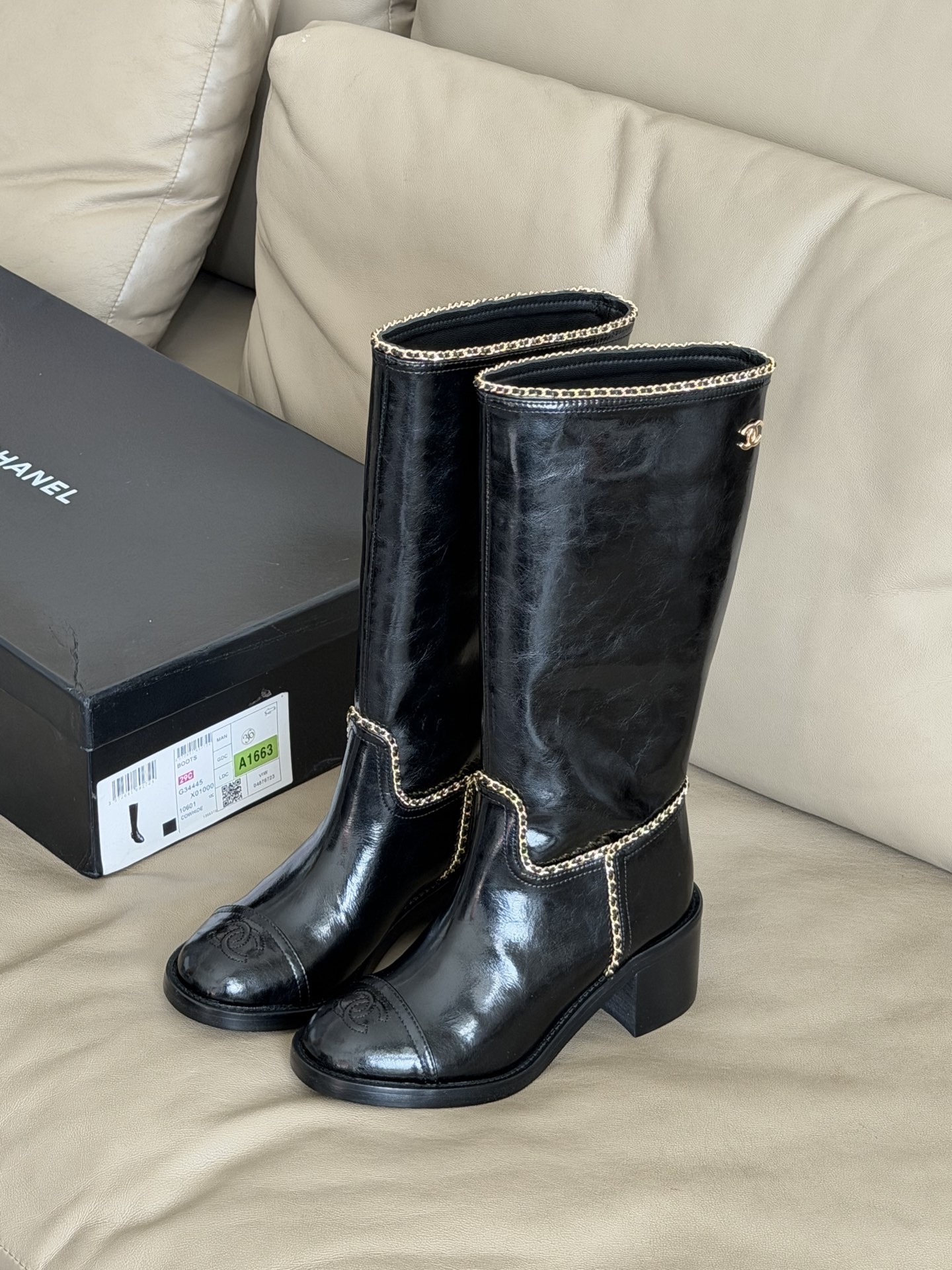 Bagsaaa Ch**el mid-calf boots in black patent leather with cap toes