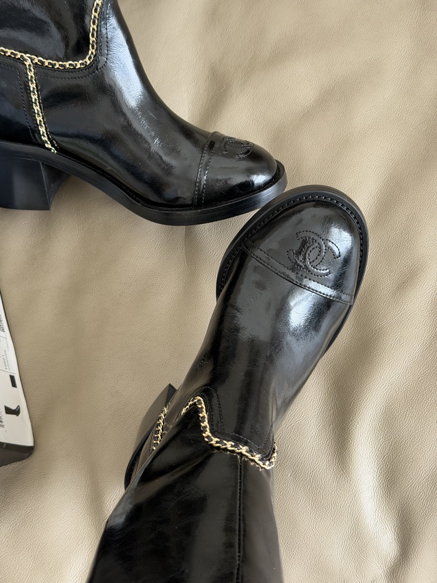 Bagsaaa Ch**el mid-calf boots in black patent leather with cap toes