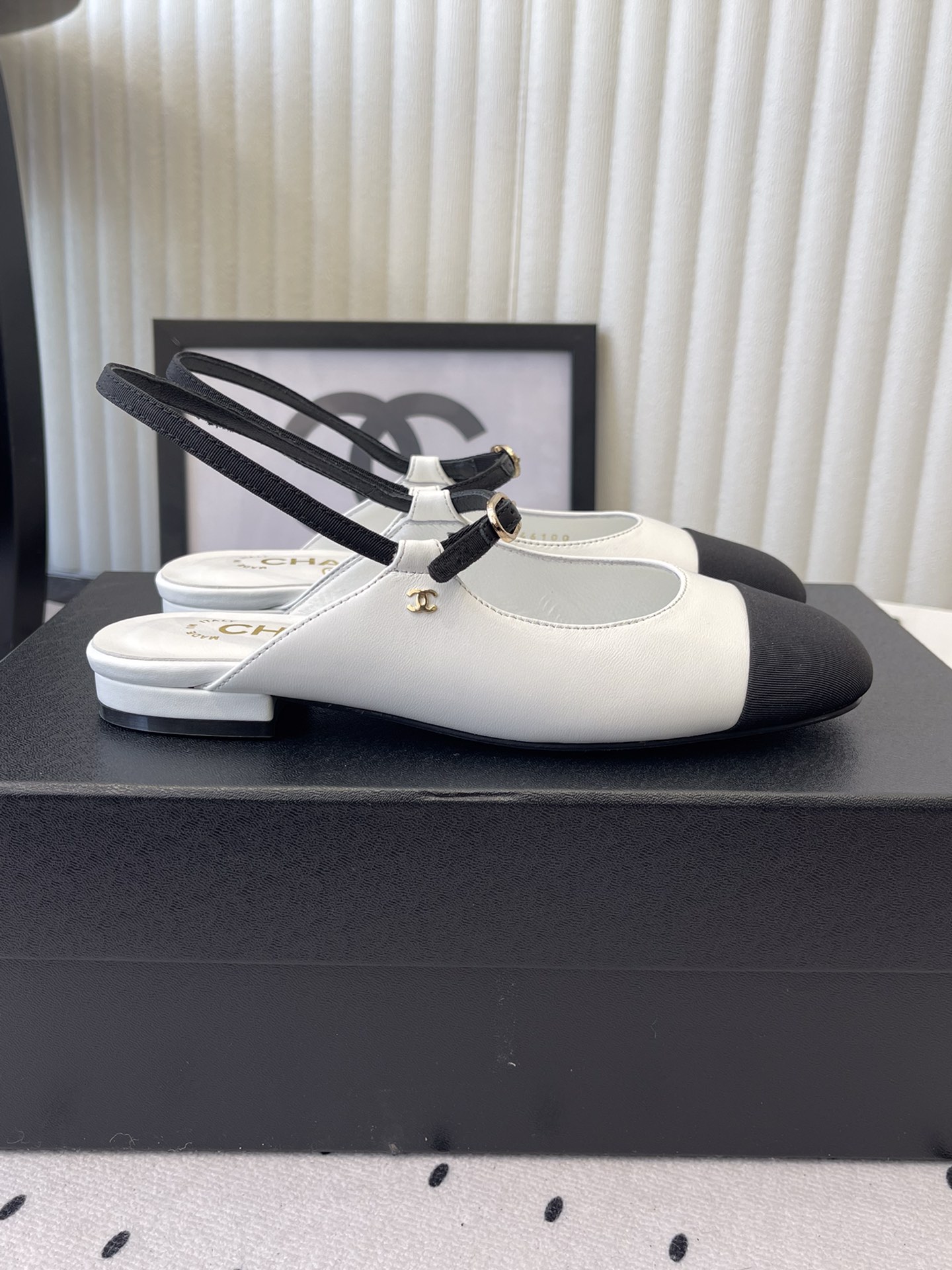 Bagsaaa Ch**el leather Mary Jane flats in white and black with an ankle strap
