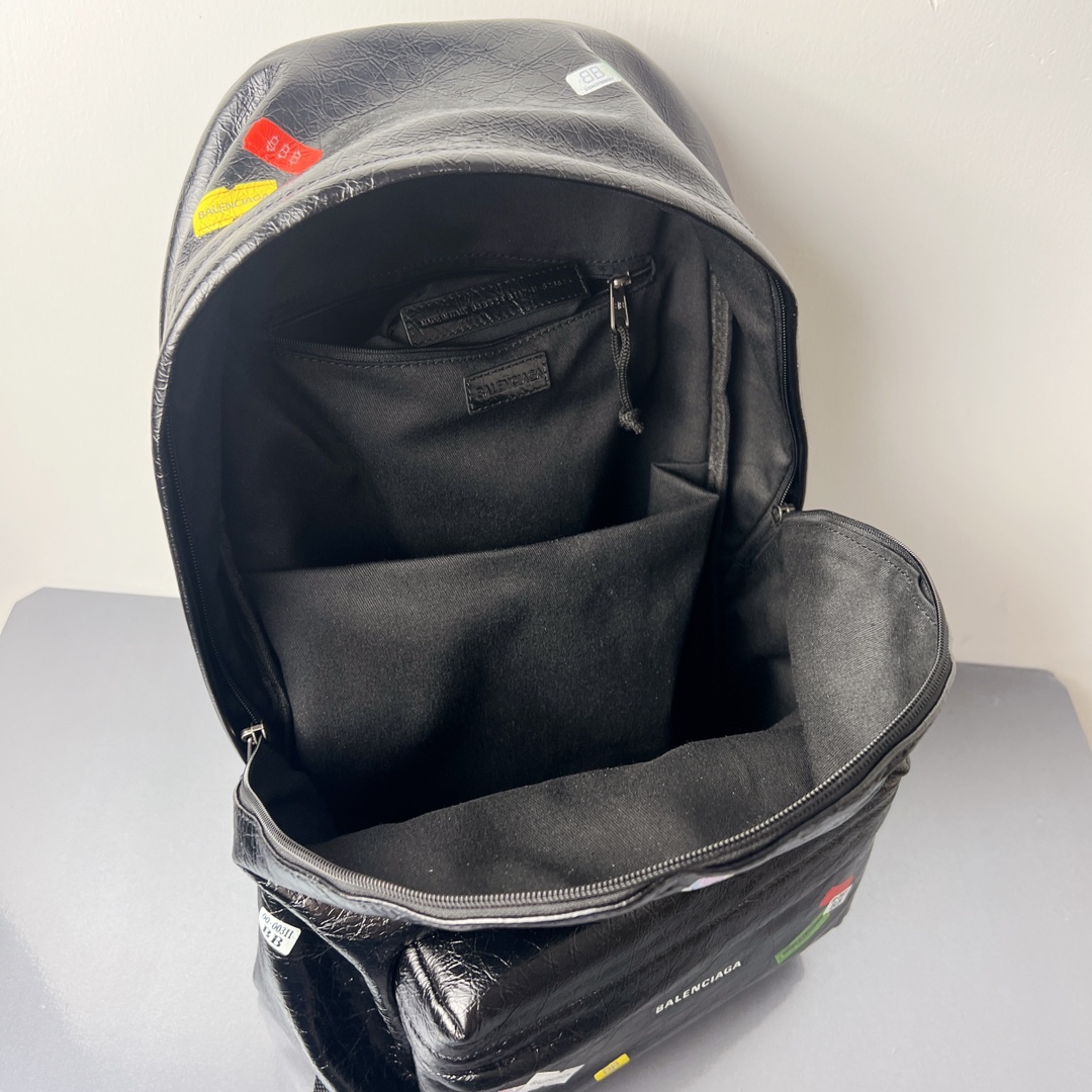 Bagsaaa Ba1en*iaga Explorer Backpack in black Arena lambskin with printed stickers - 47cm