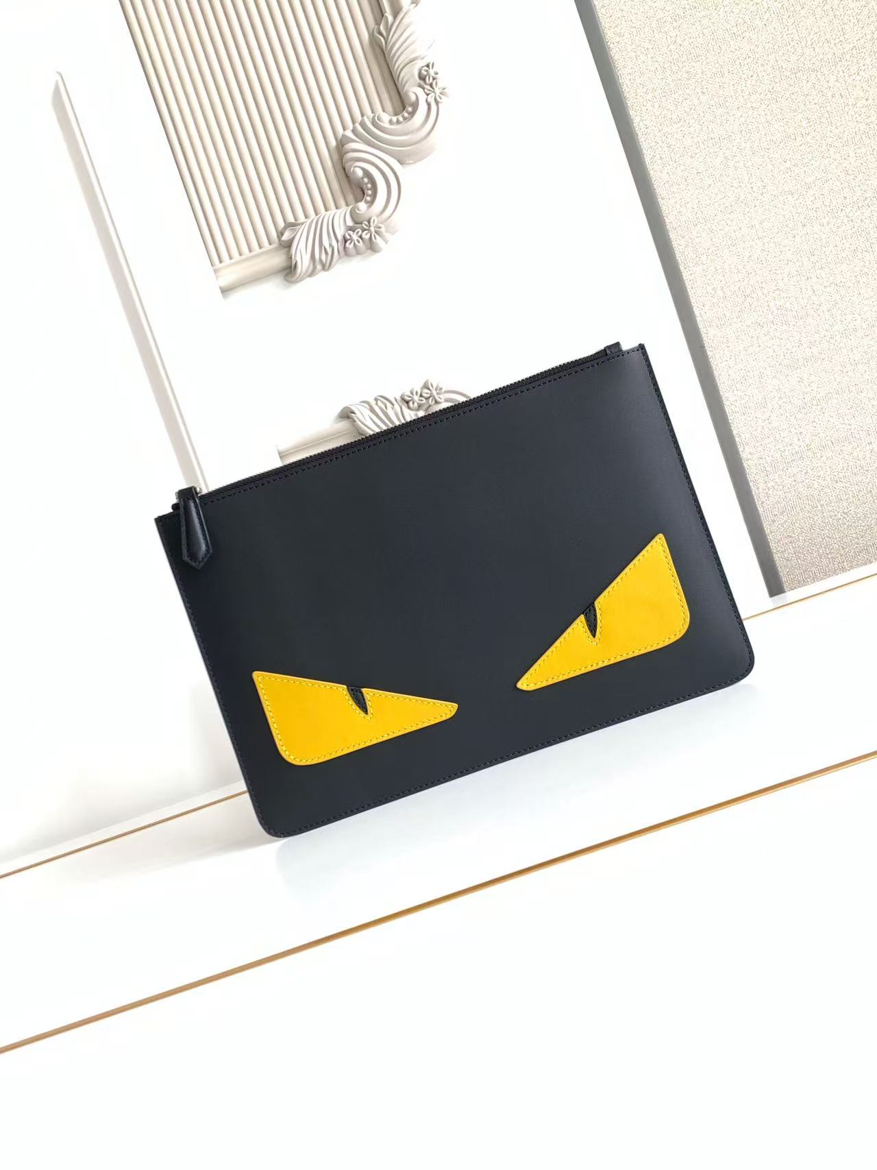 Bagsaaa F**di Monster Eyes leather clutch bag in black with yellow - 30cm