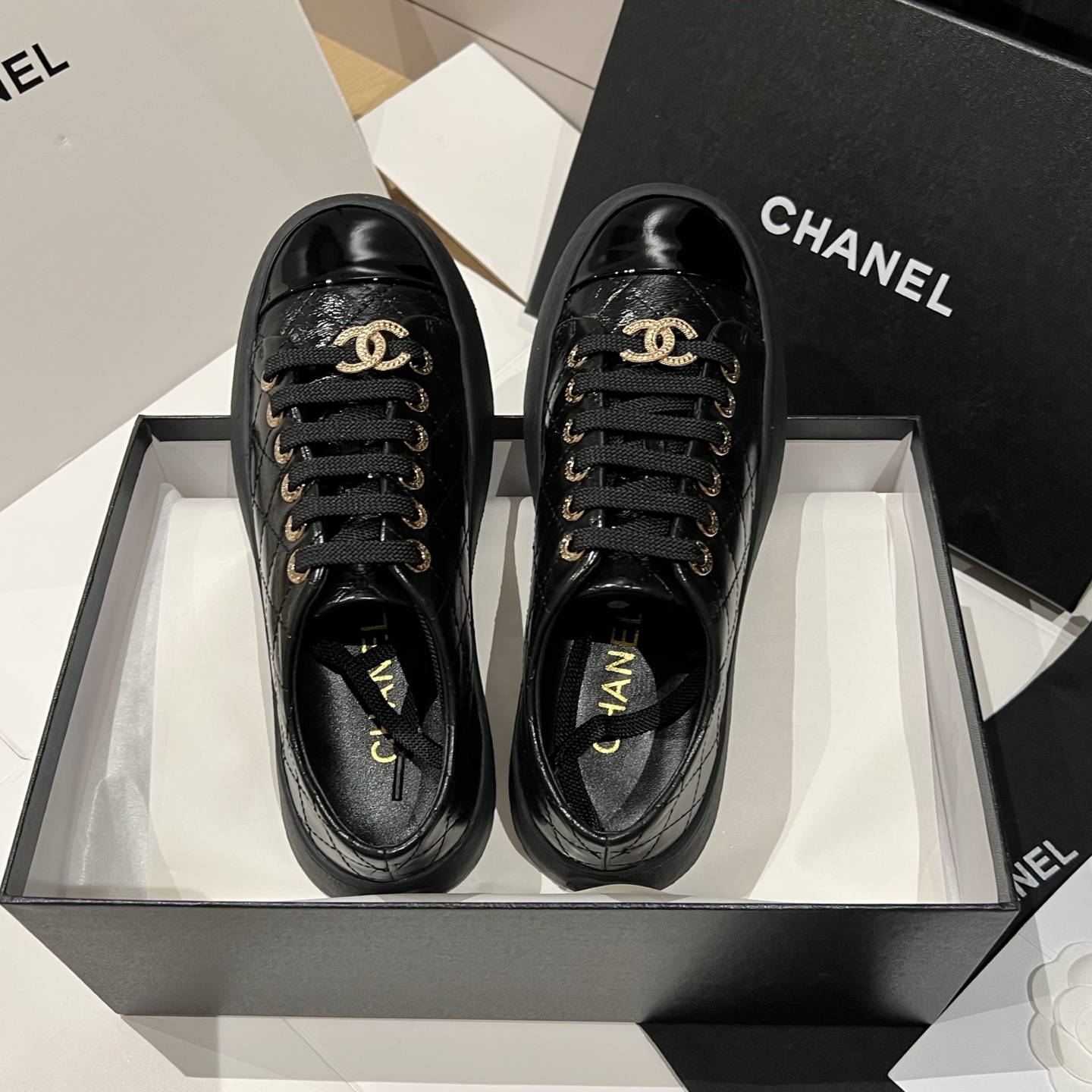 Bagsaaa black patent leather Ch**el low-top sneakers with gold-tone hardware