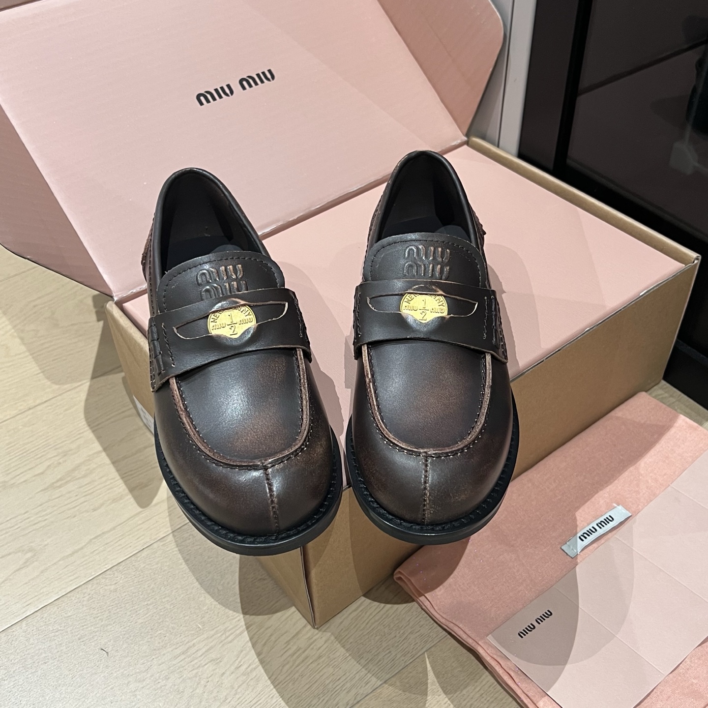 Bagsaaa Miu Miu distressed leather penny loafers dark brown